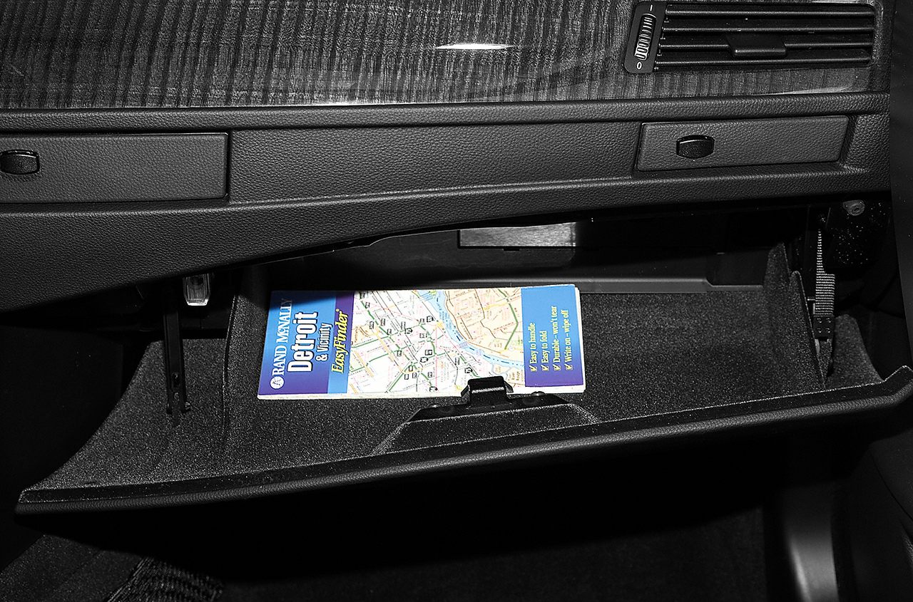 Open glove box with dashboard and interior storage compartment