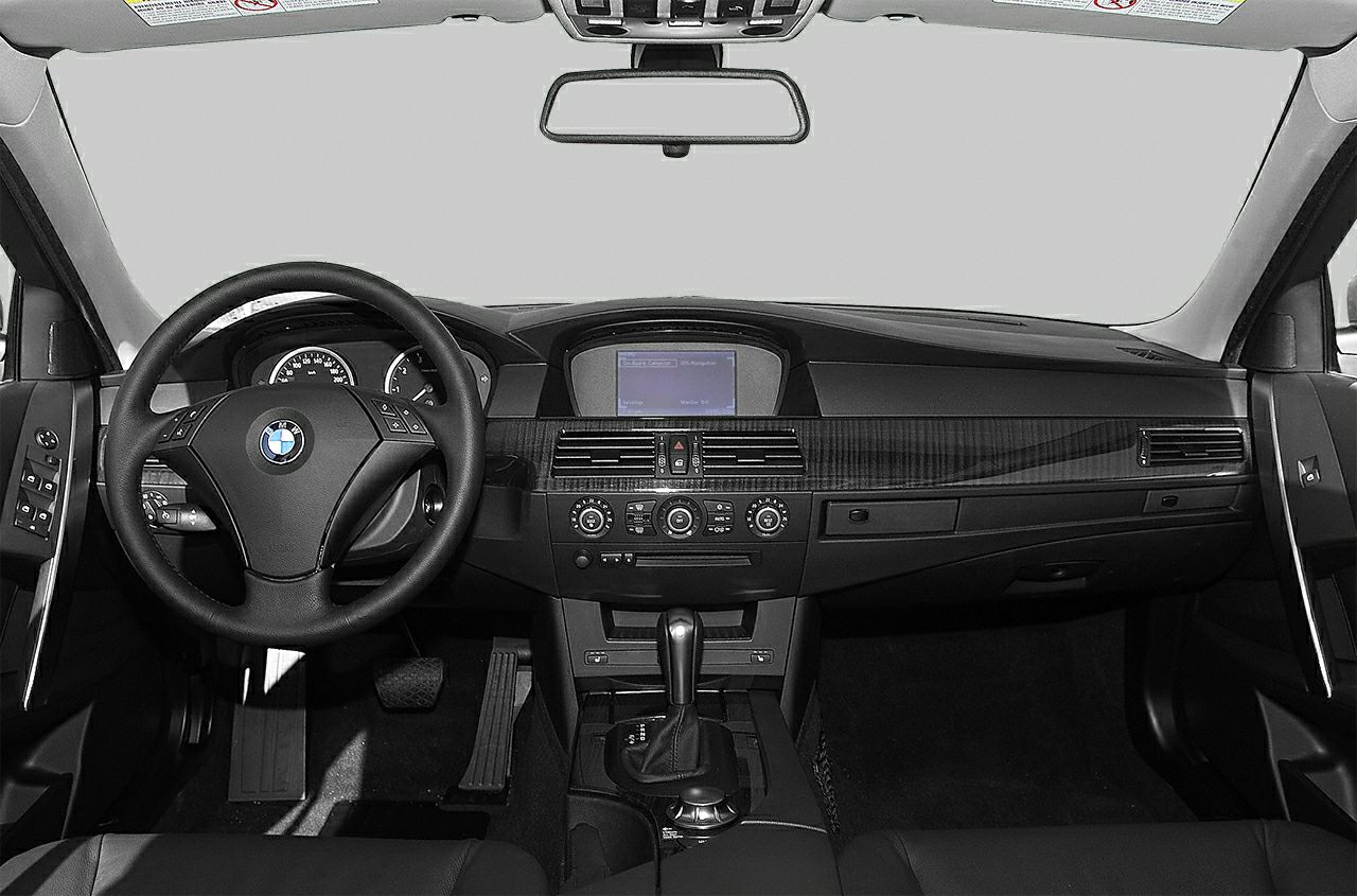 Interior view with dashboard, multifunction steering wheel, and central infotainment display