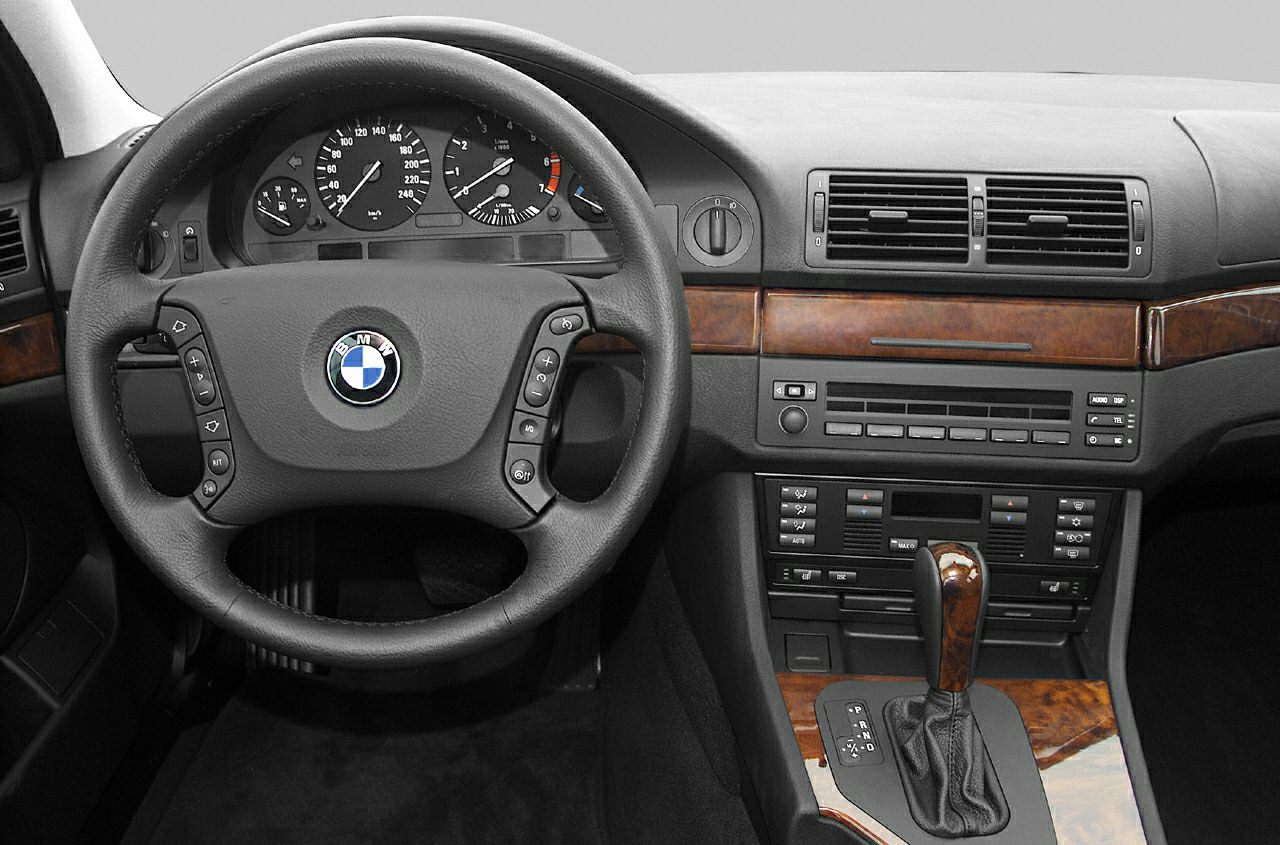 Steering wheel and dashboard with wooden trim and automatic shifter