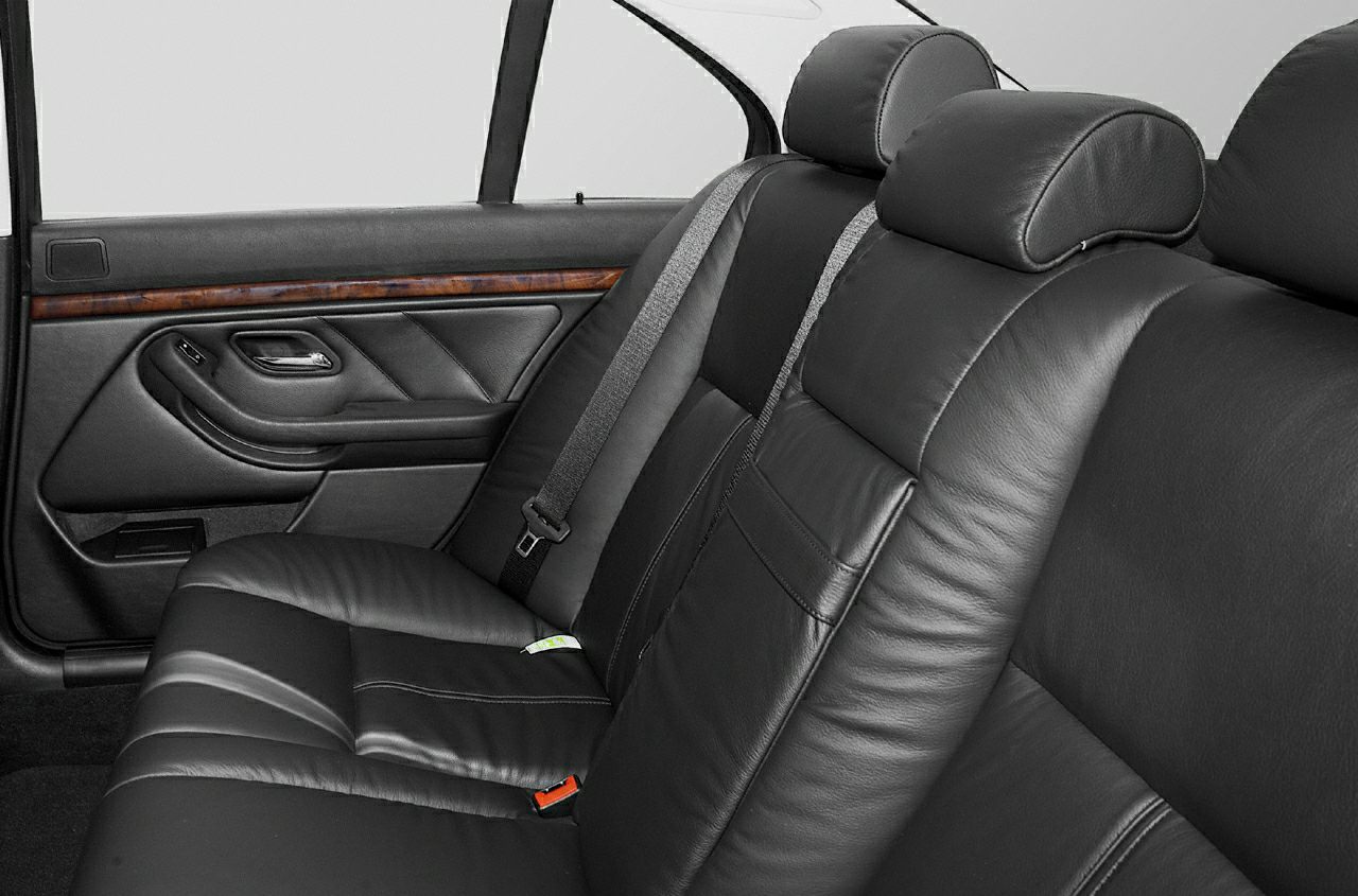Rear leather seats and door panel with wood trim