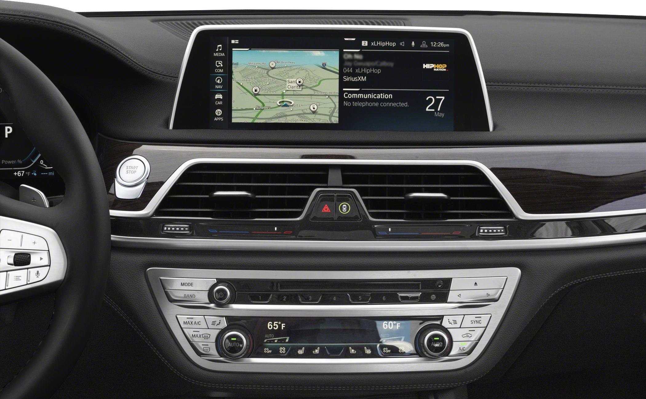 Car dashboard with infotainment screen and climate control panel