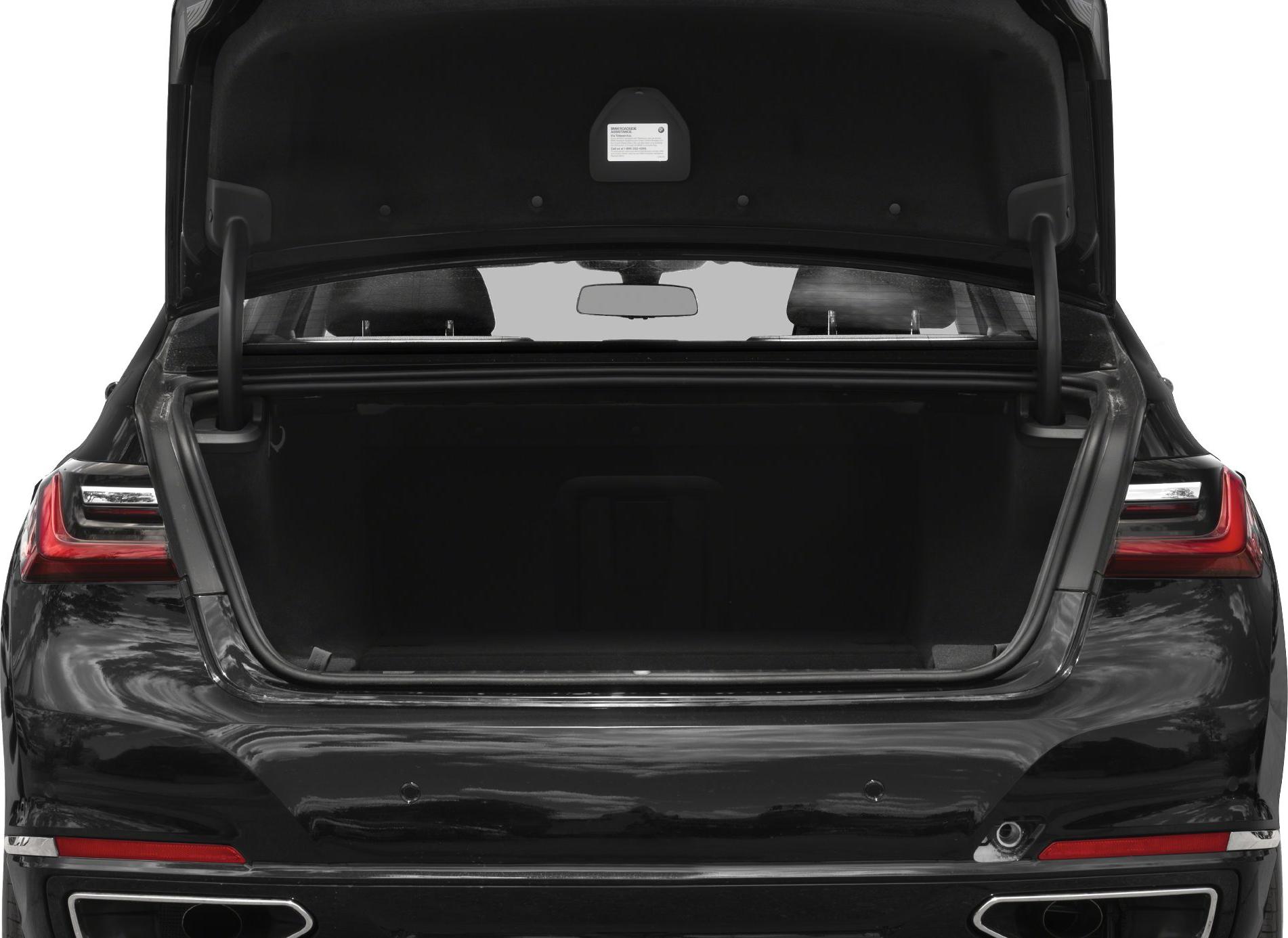 Open trunk of a luxury sedan with spacious cargo area and modern taillights