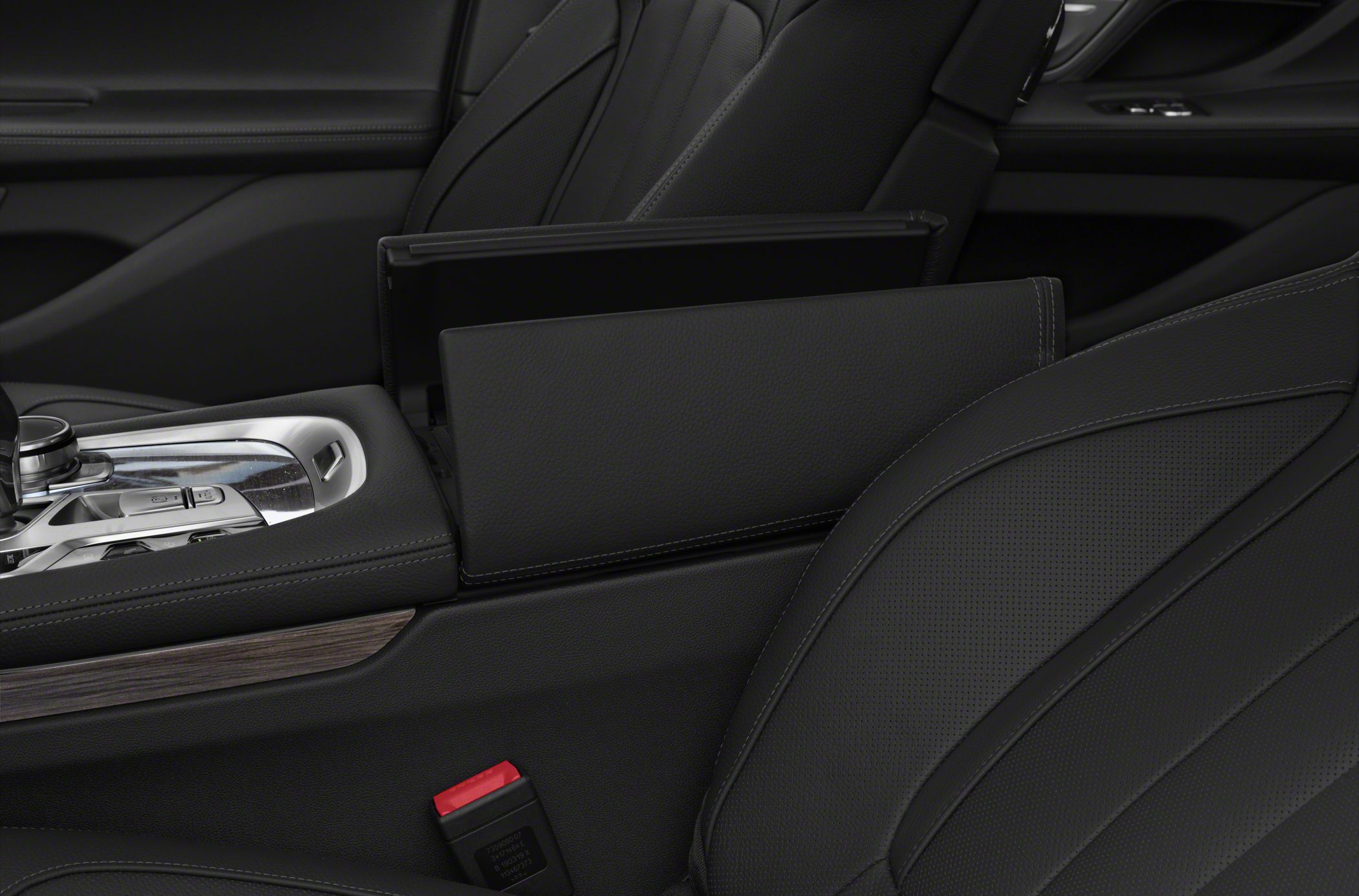 Leather armrest and center console with control buttons and chrome details