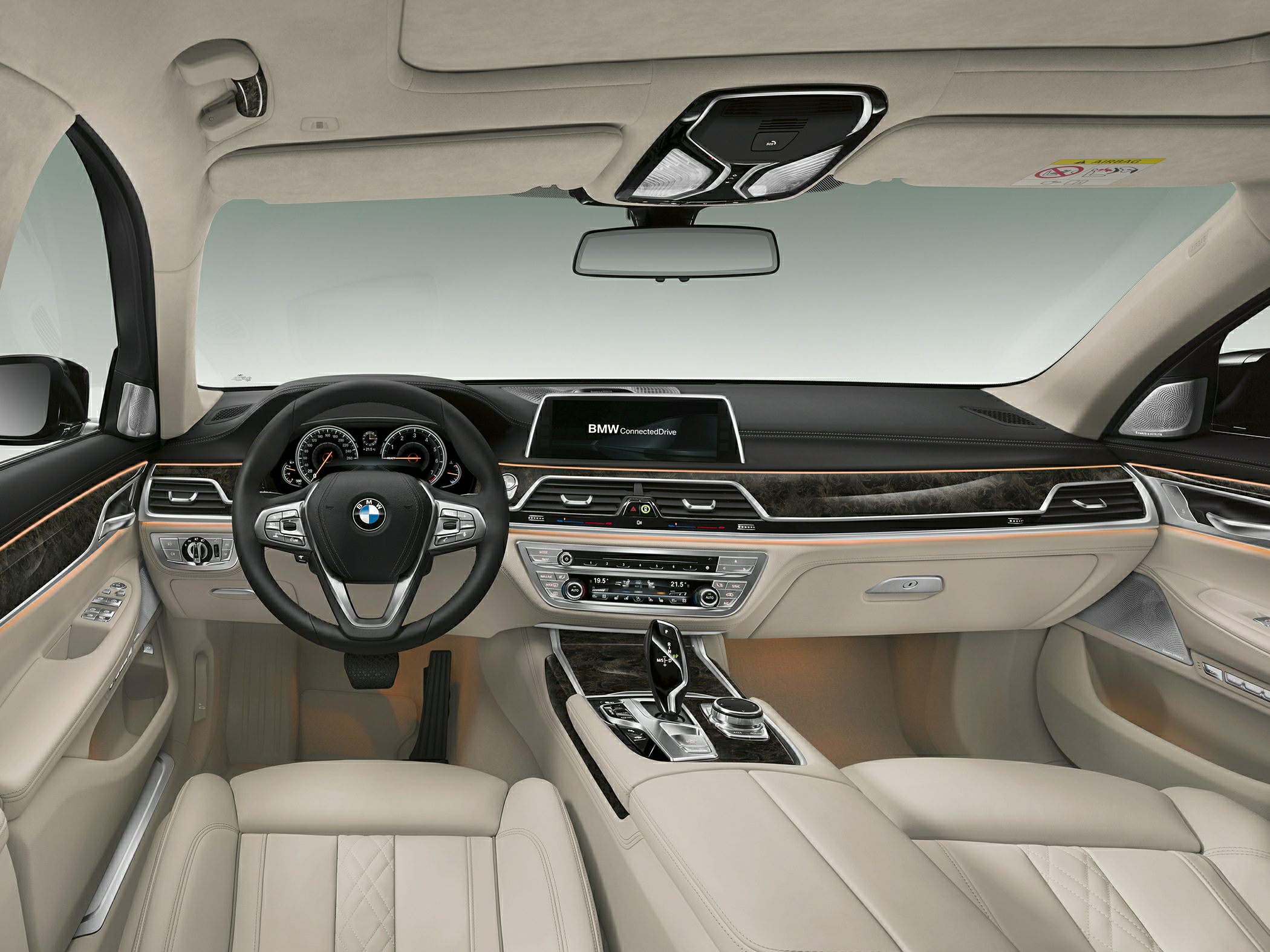 Luxurious beige leather interior with digital dashboard and wood trim