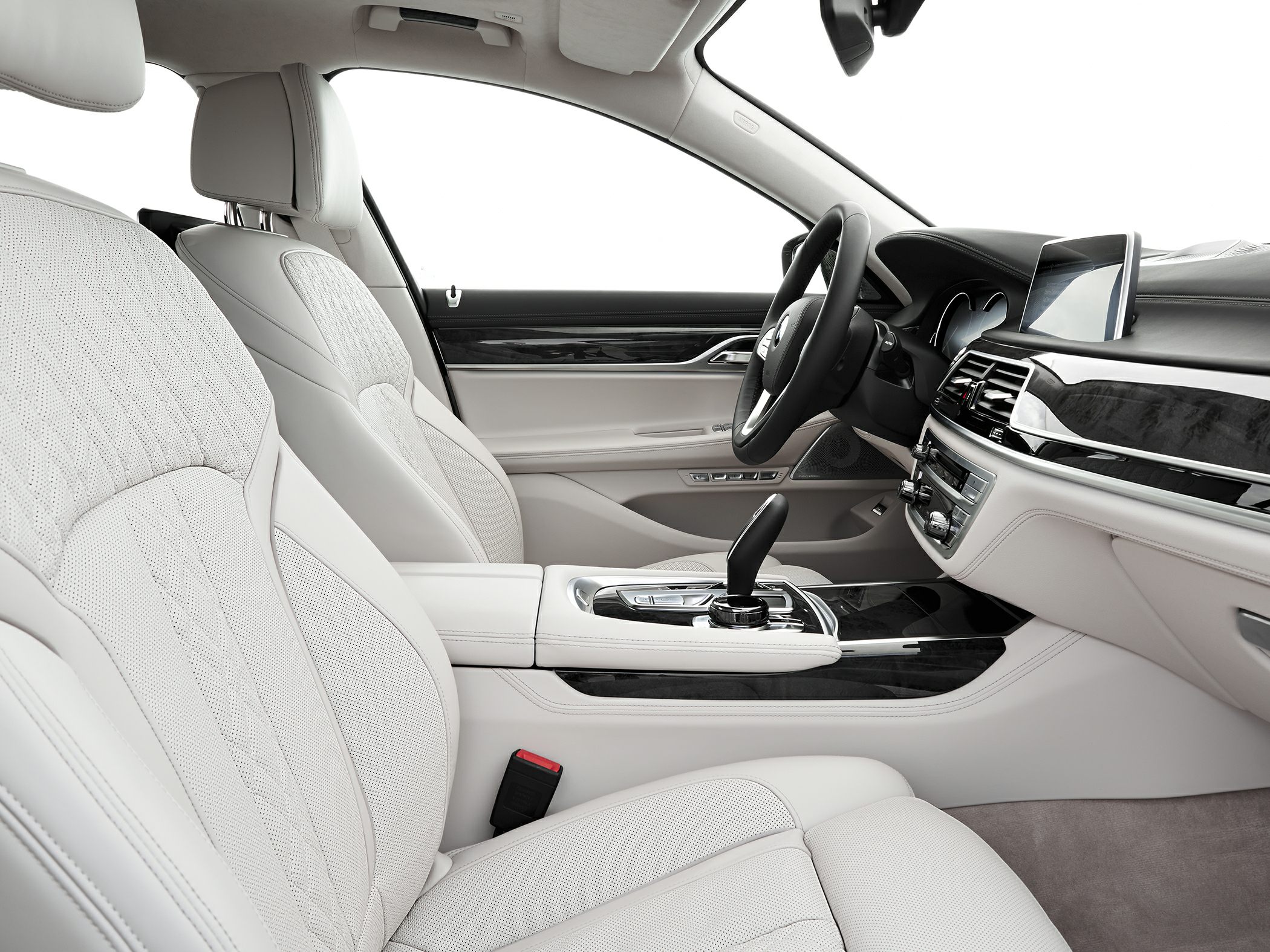 Luxury white leather seats and modern dashboard with gear shift