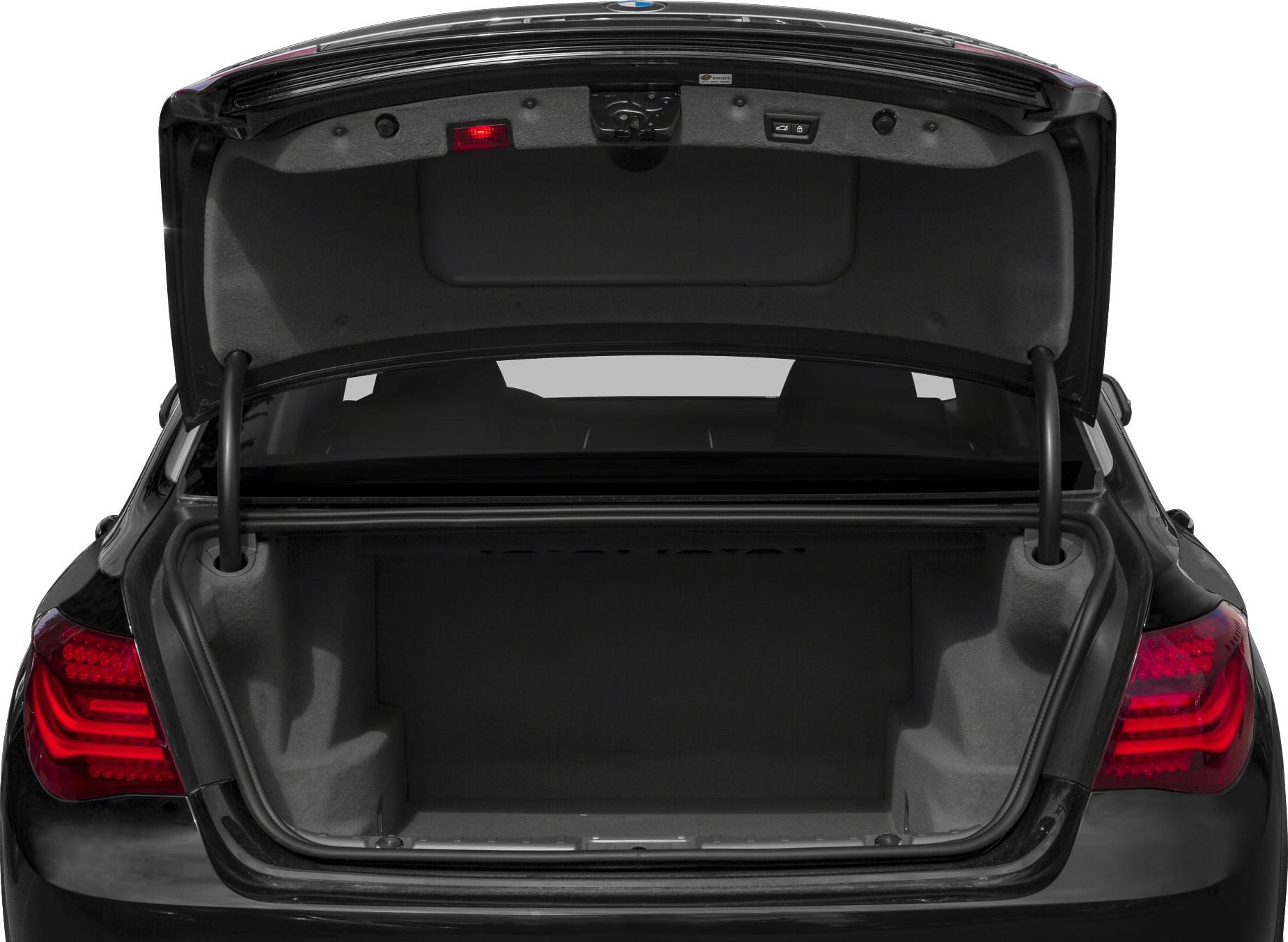 Open spacious trunk of a luxury sedan with visible taillights.