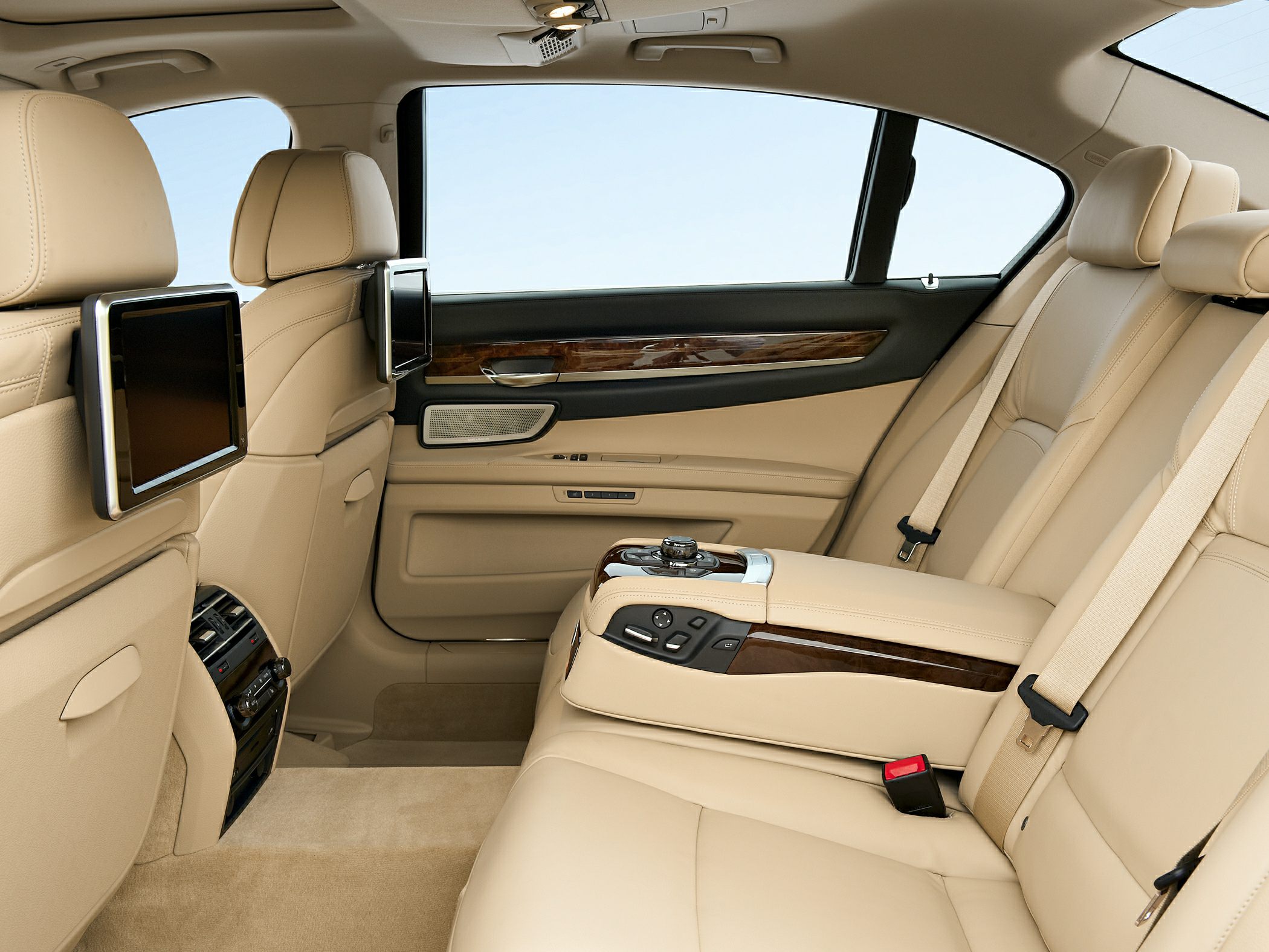 Luxury rear seat interior with dual screens and advanced controls