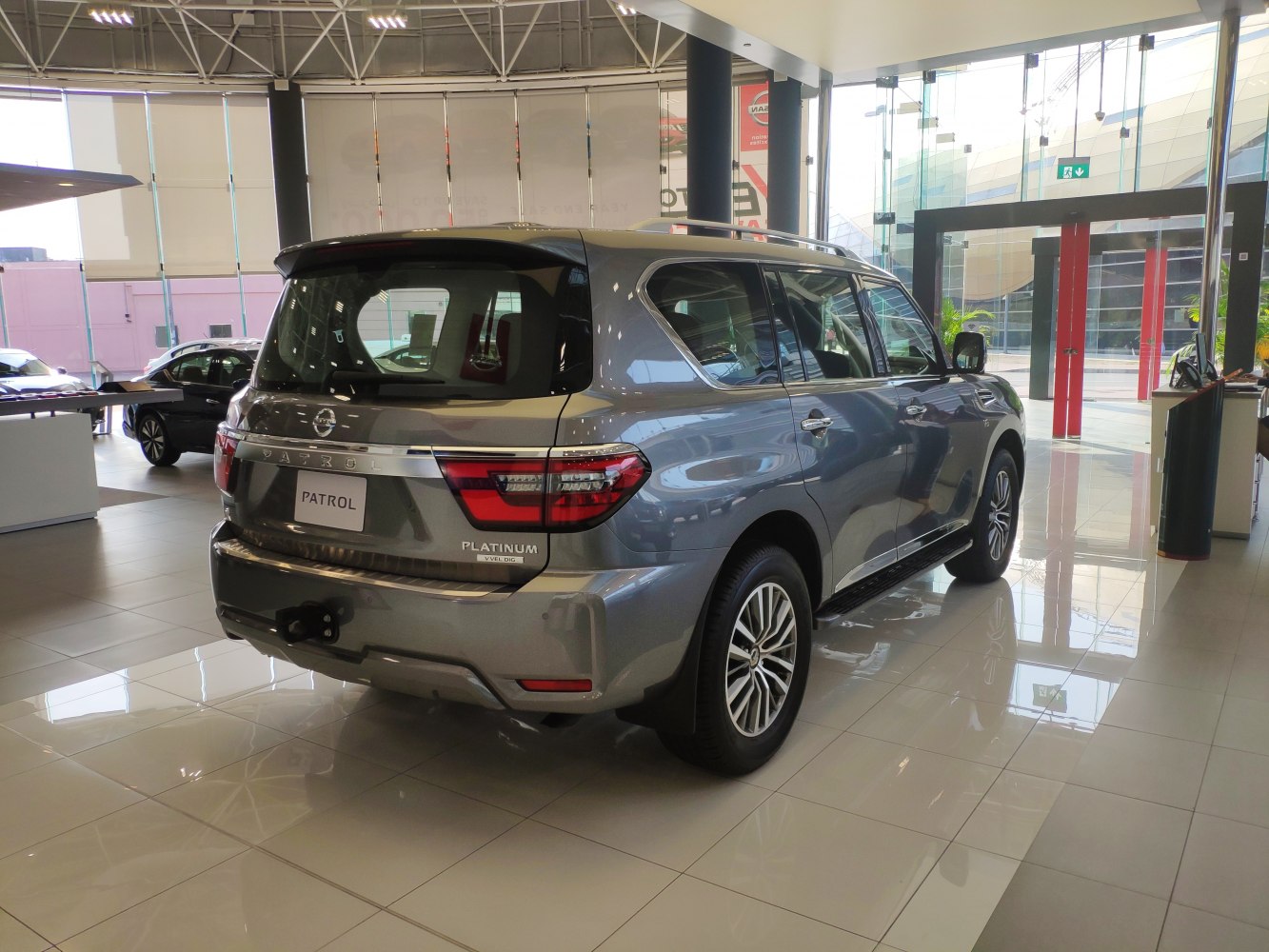 Rear three-quarter view showcasing tail lights and rear body design of large SUV