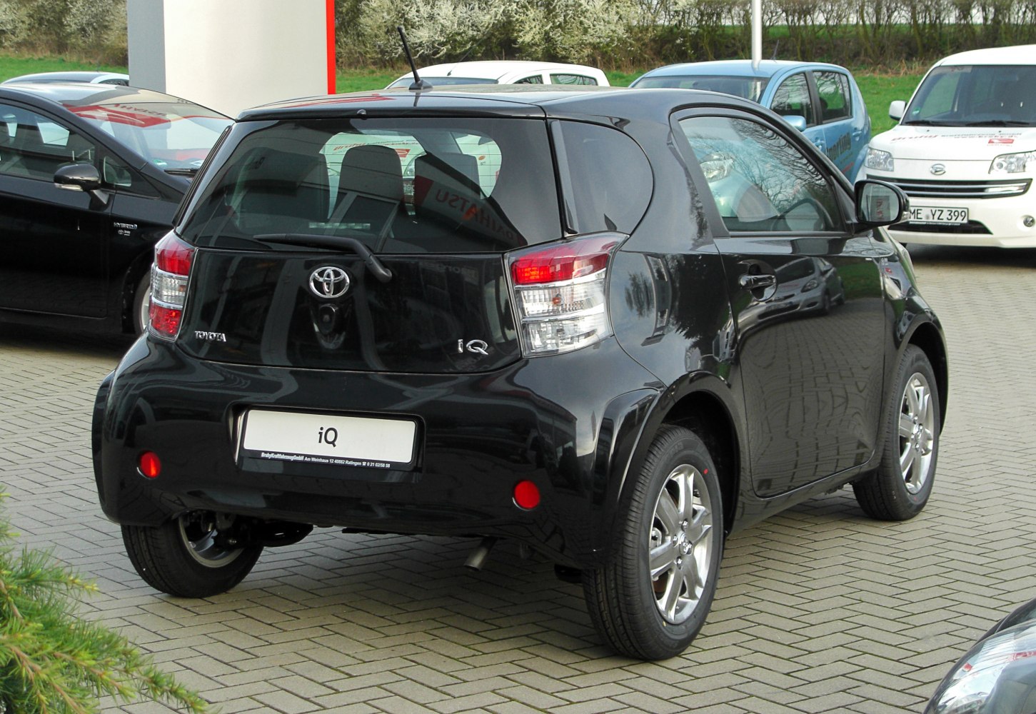Compact hatchback rear view with distinctive taillights and smooth curves