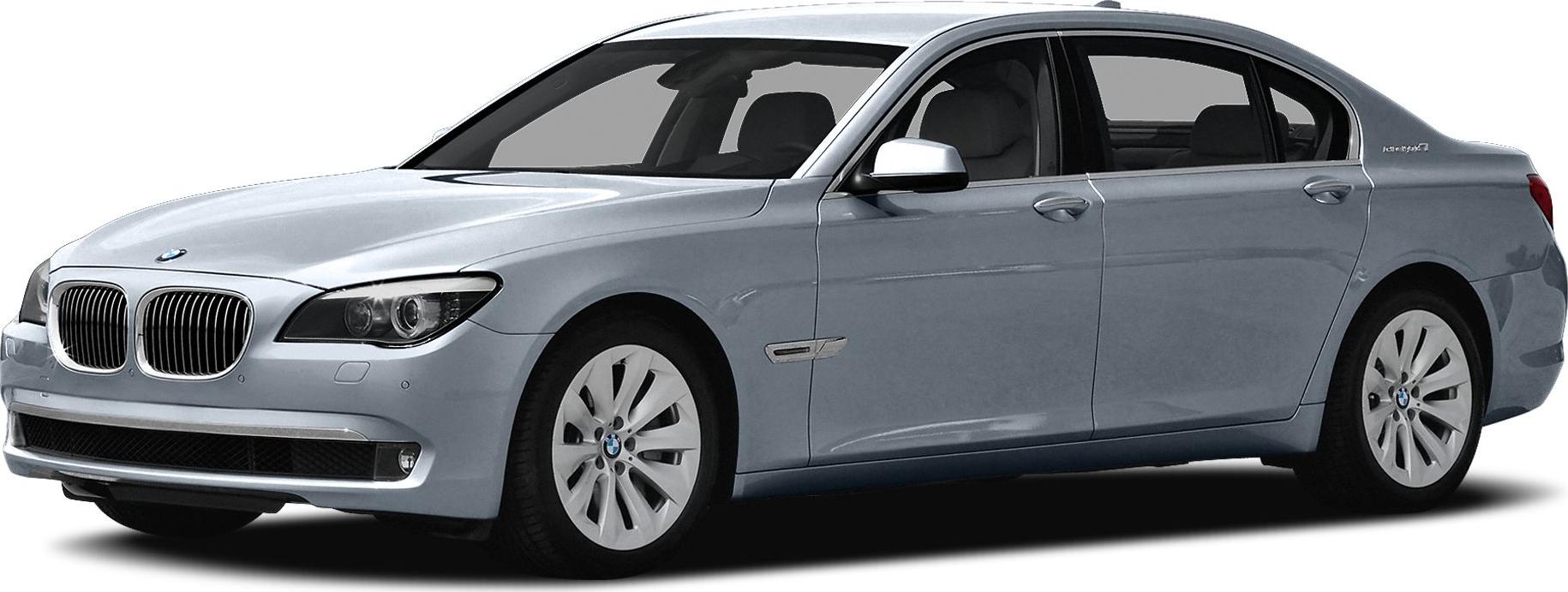 Luxury hybrid sedan side profile with front grille and hybrid badge