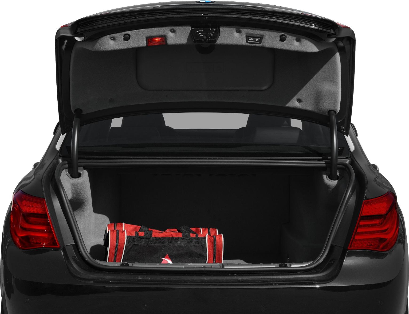Open trunk with spacious cargo area and red bag inside