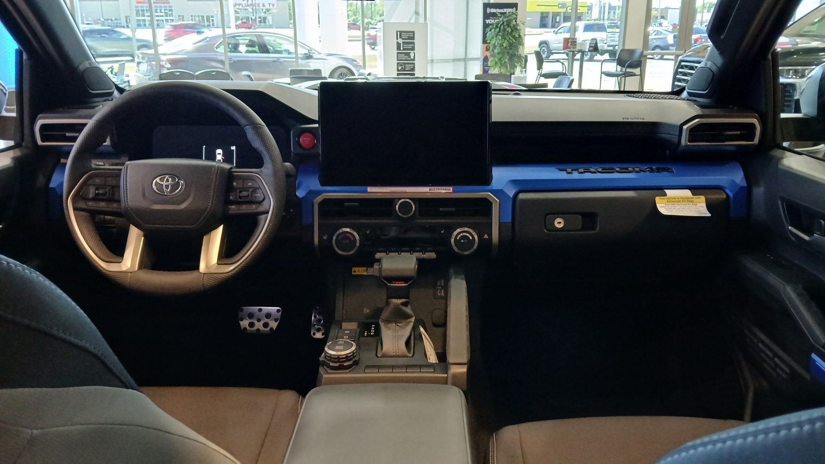 Modern dashboard with central touchscreen and multifunction steering wheel