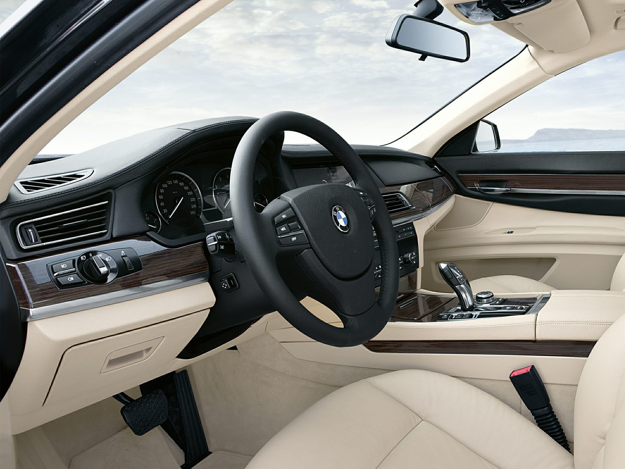 Luxury car interior with leather seats and wood trim