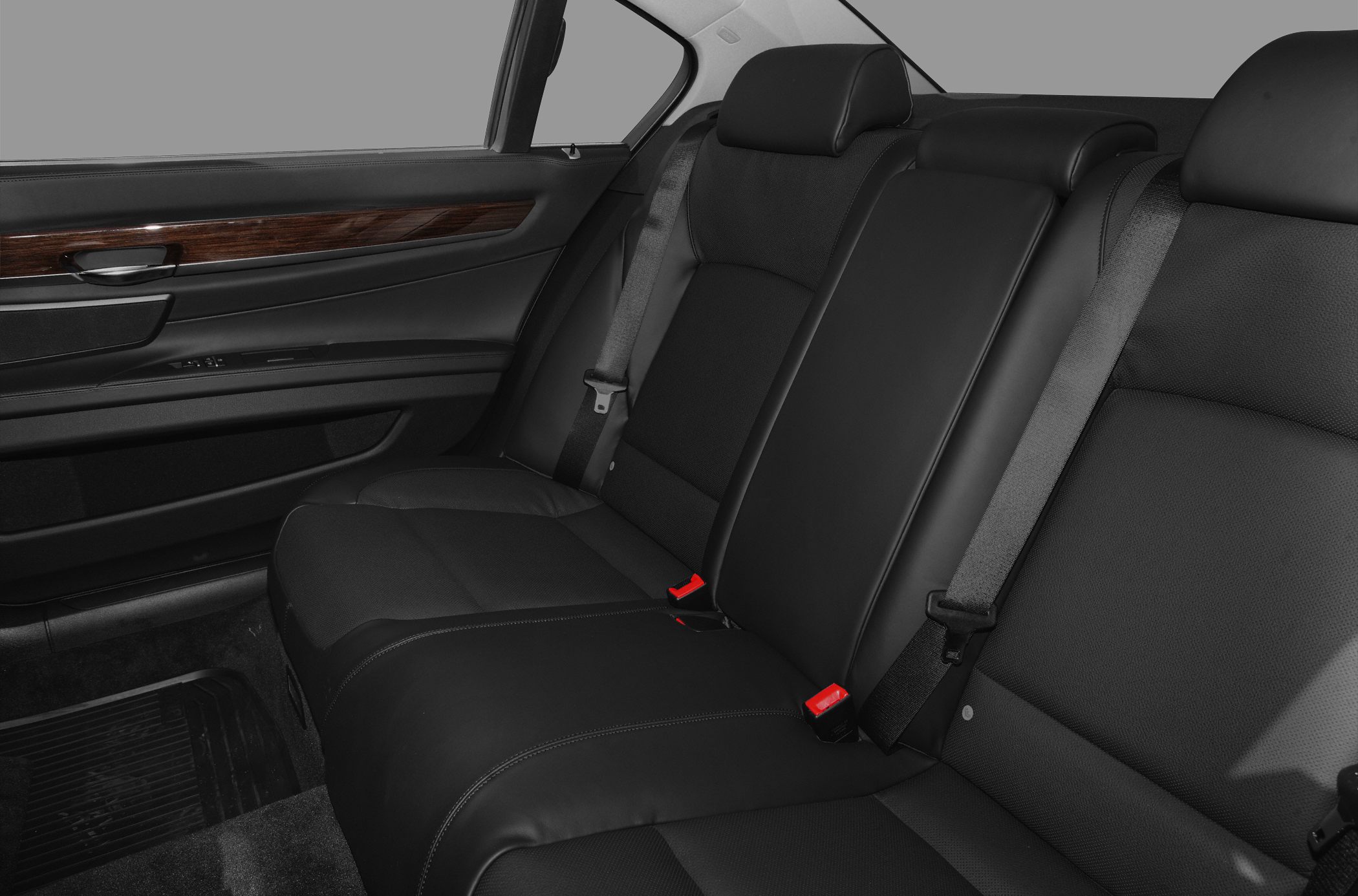 Rear leather seats with wood trim and seat belt details