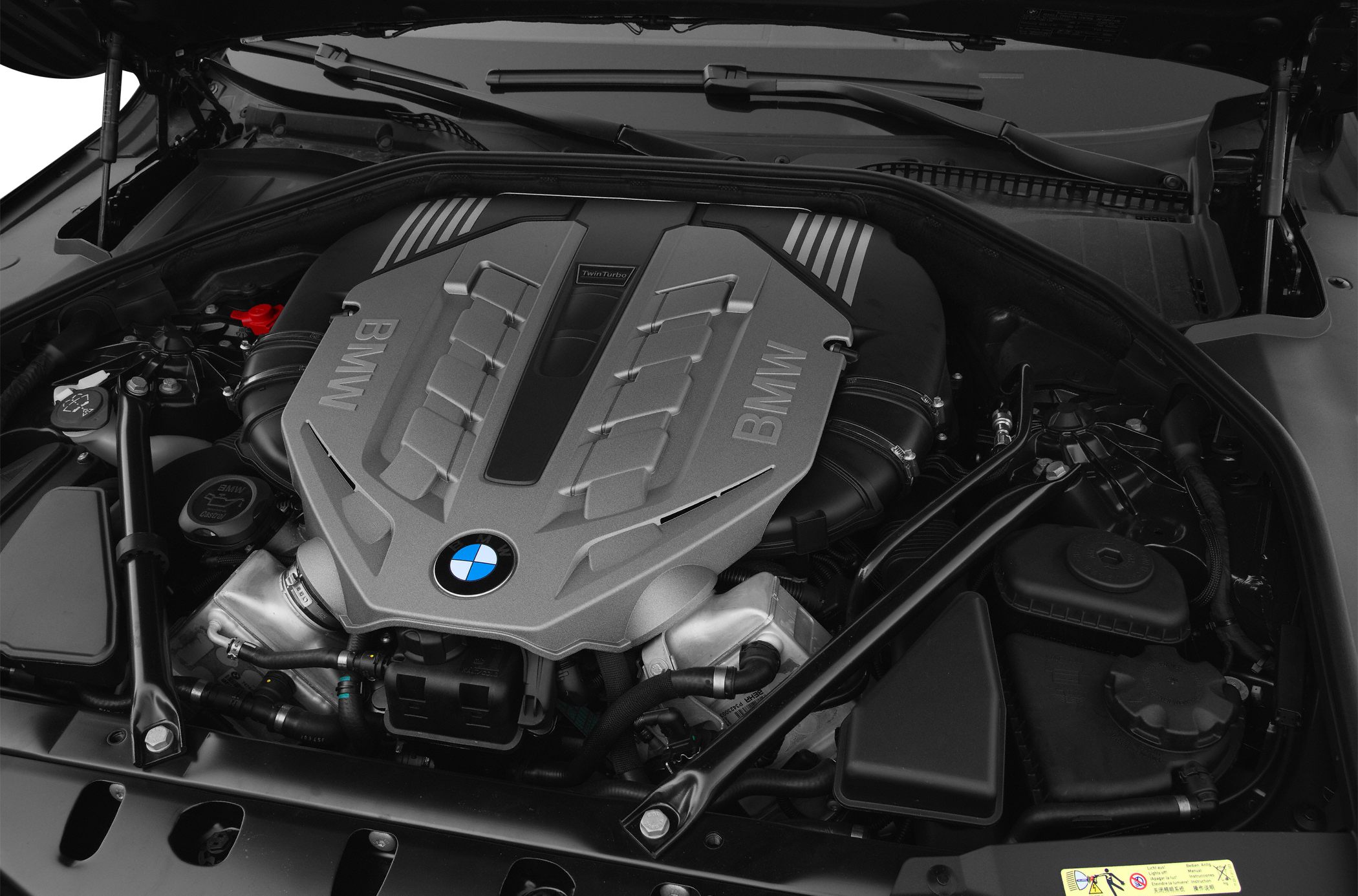 Twin turbo engine with BMW branding and structural engine bay components