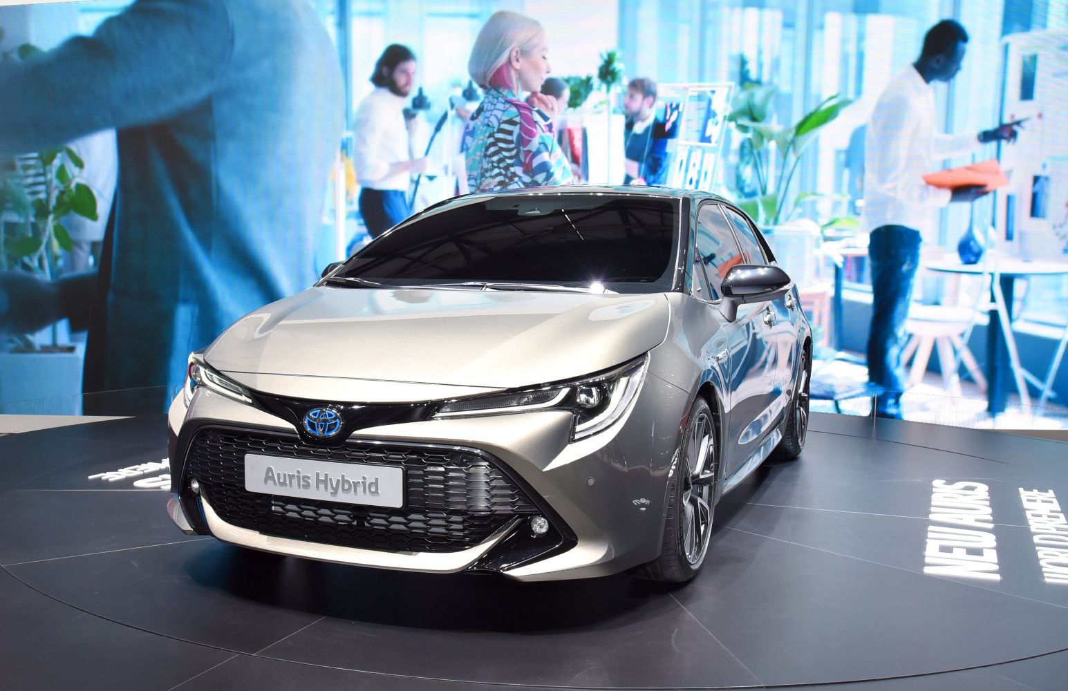 Front view with grille and headlights of a modern hybrid compact vehicle