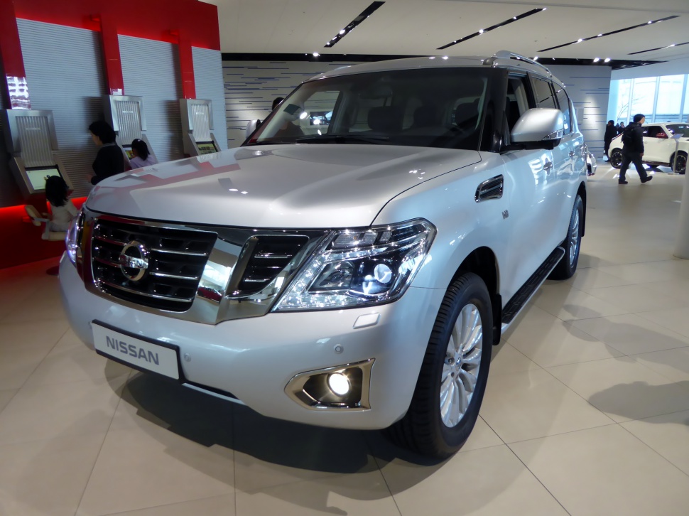 SUV with LED headlights and chrome grille in showroom lighting