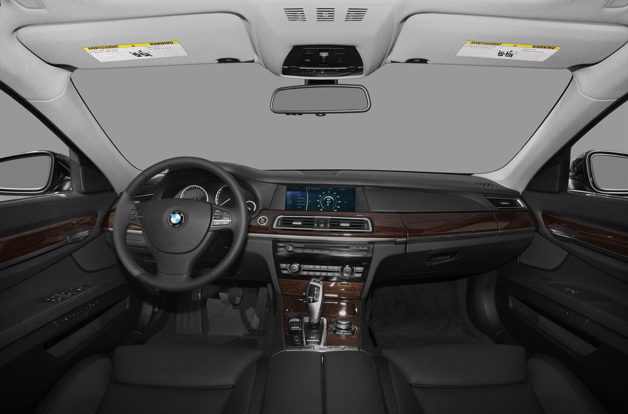 Luxury dashboard and steering wheel with wood trim and advanced controls