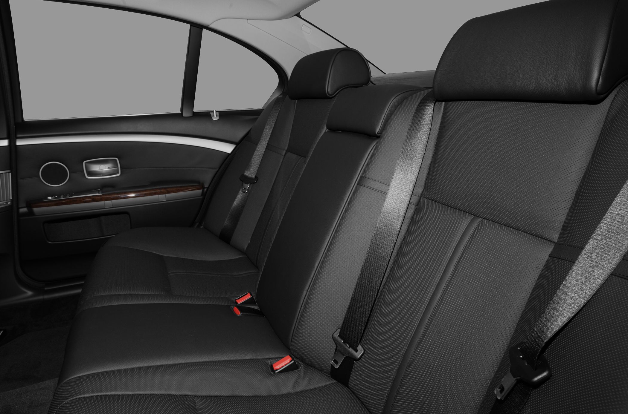Rear seat with leather upholstery and integrated seat belts