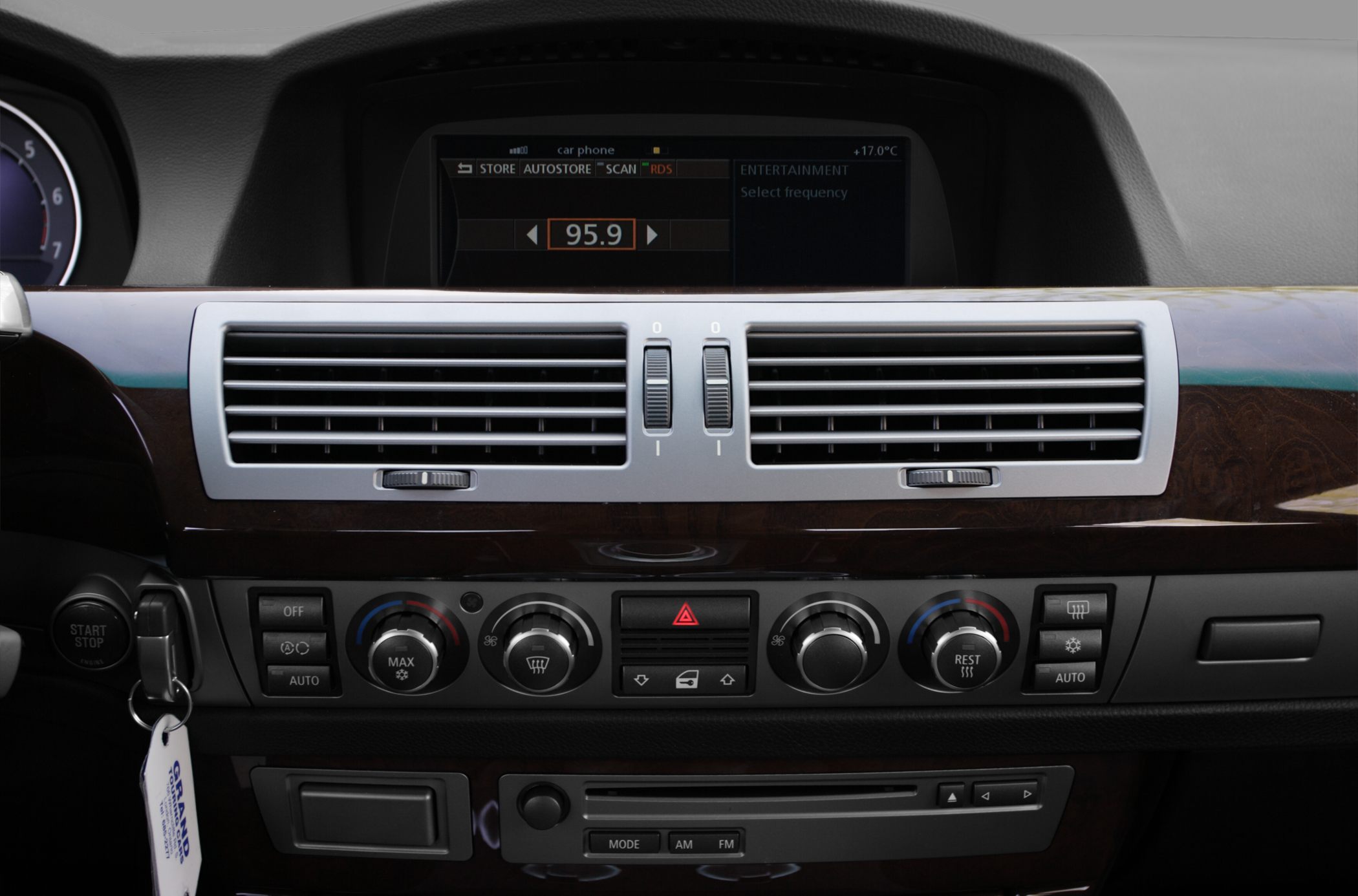 Dashboard with dual air vents, climate controls, and digital display.