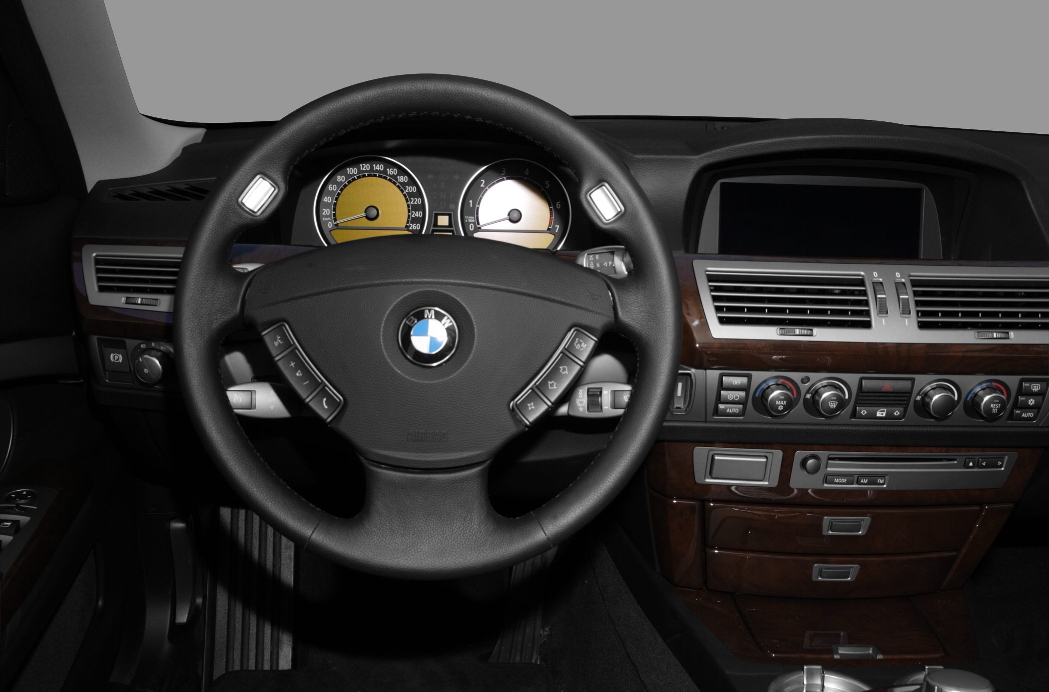 Steering wheel and dashboard with instrument cluster and climate controls
