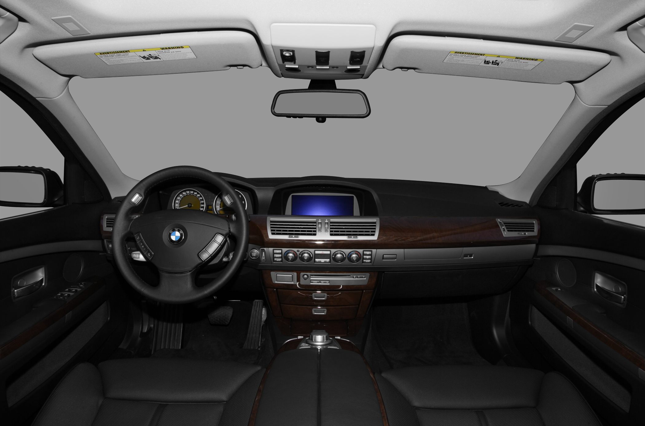 Dashboard and steering wheel with wood trim and infotainment display