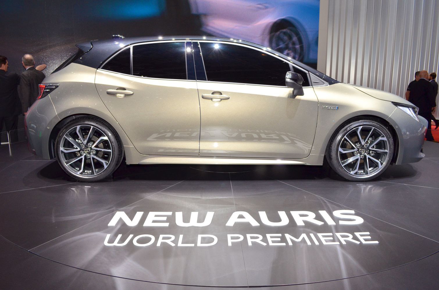 Side profile of a hatchback with hybrid badge and alloy wheels