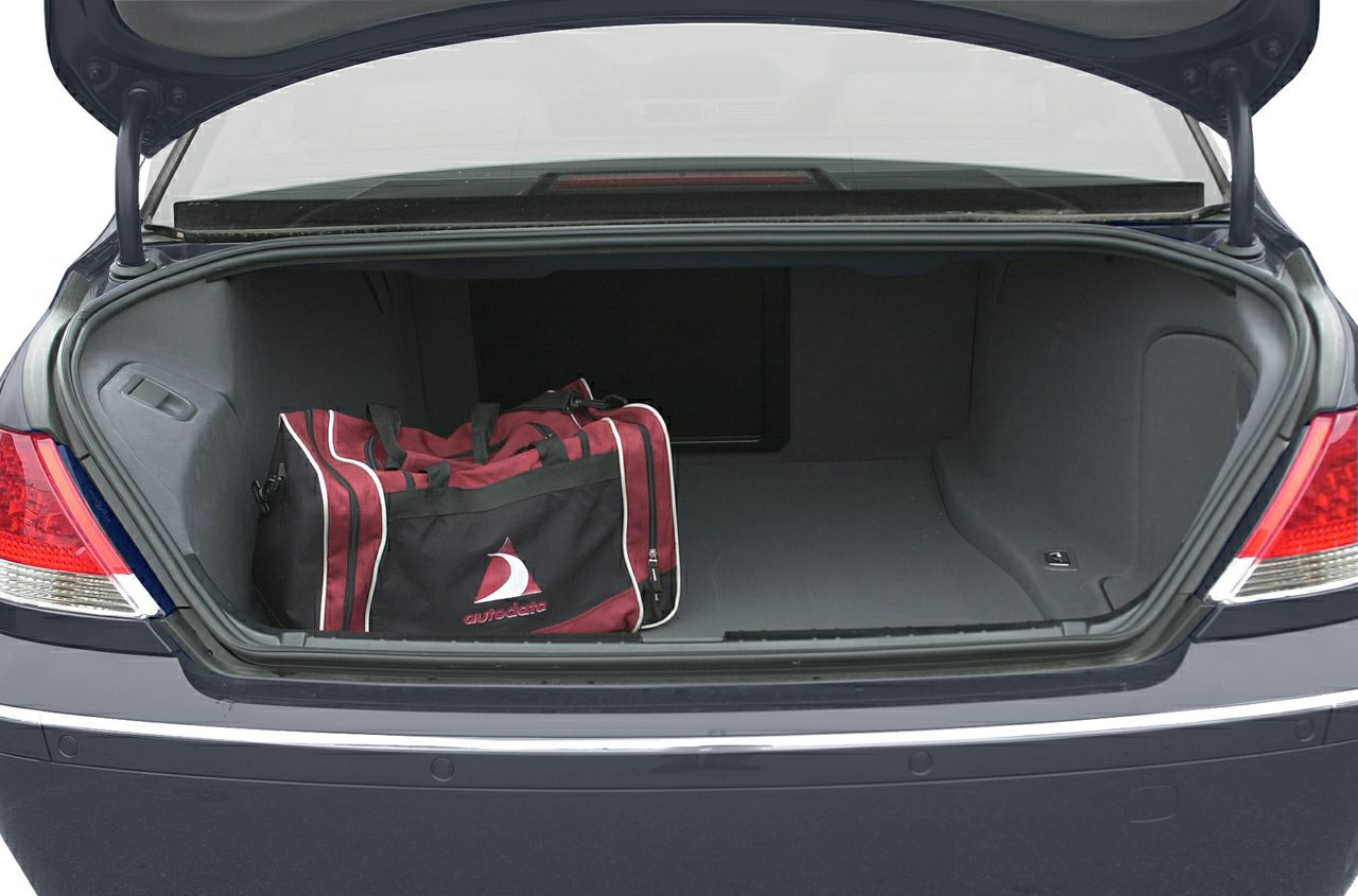 Open car trunk with spacious interior and duffel bag