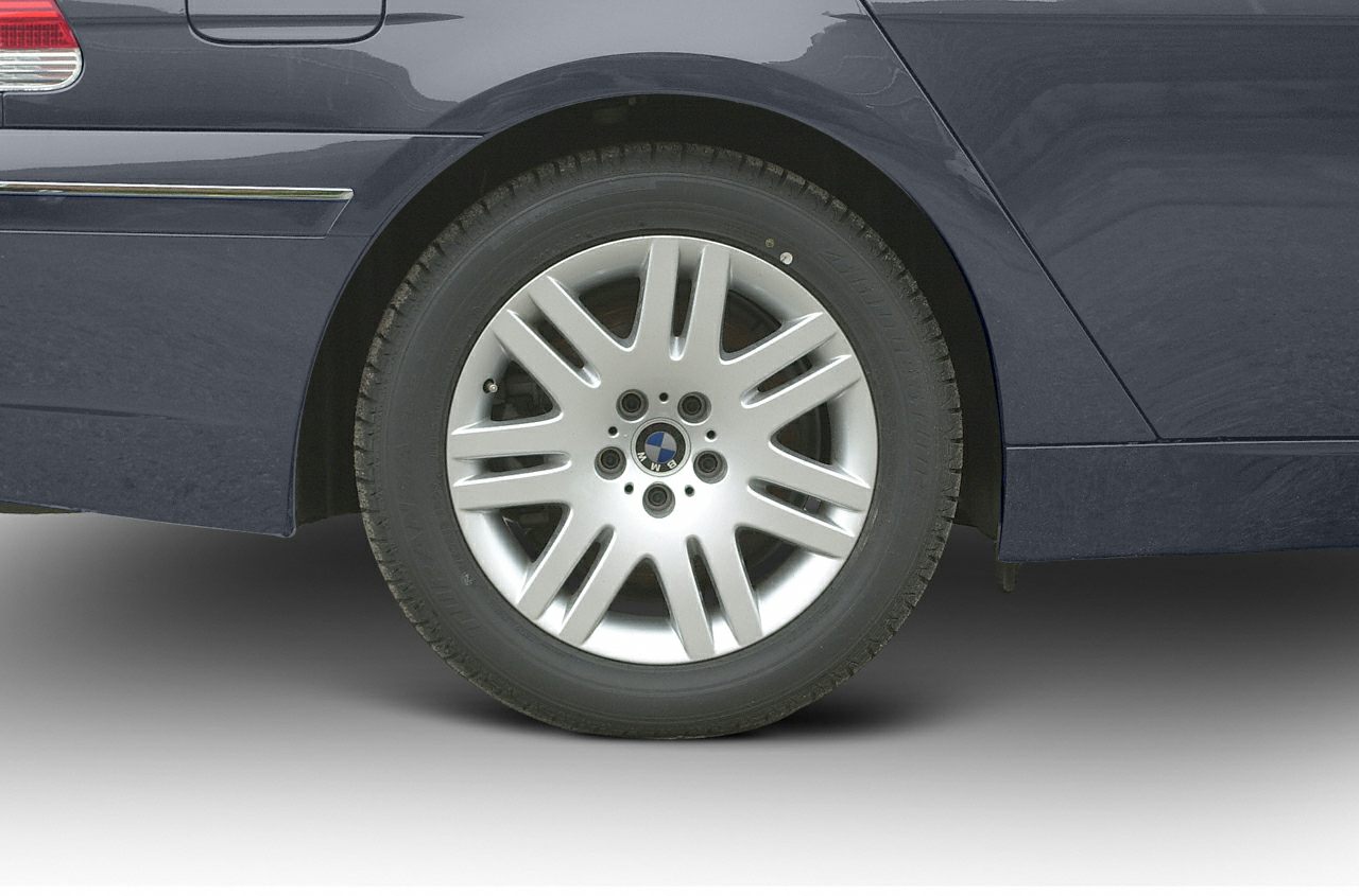 Close-up of rear alloy wheel and side panel details