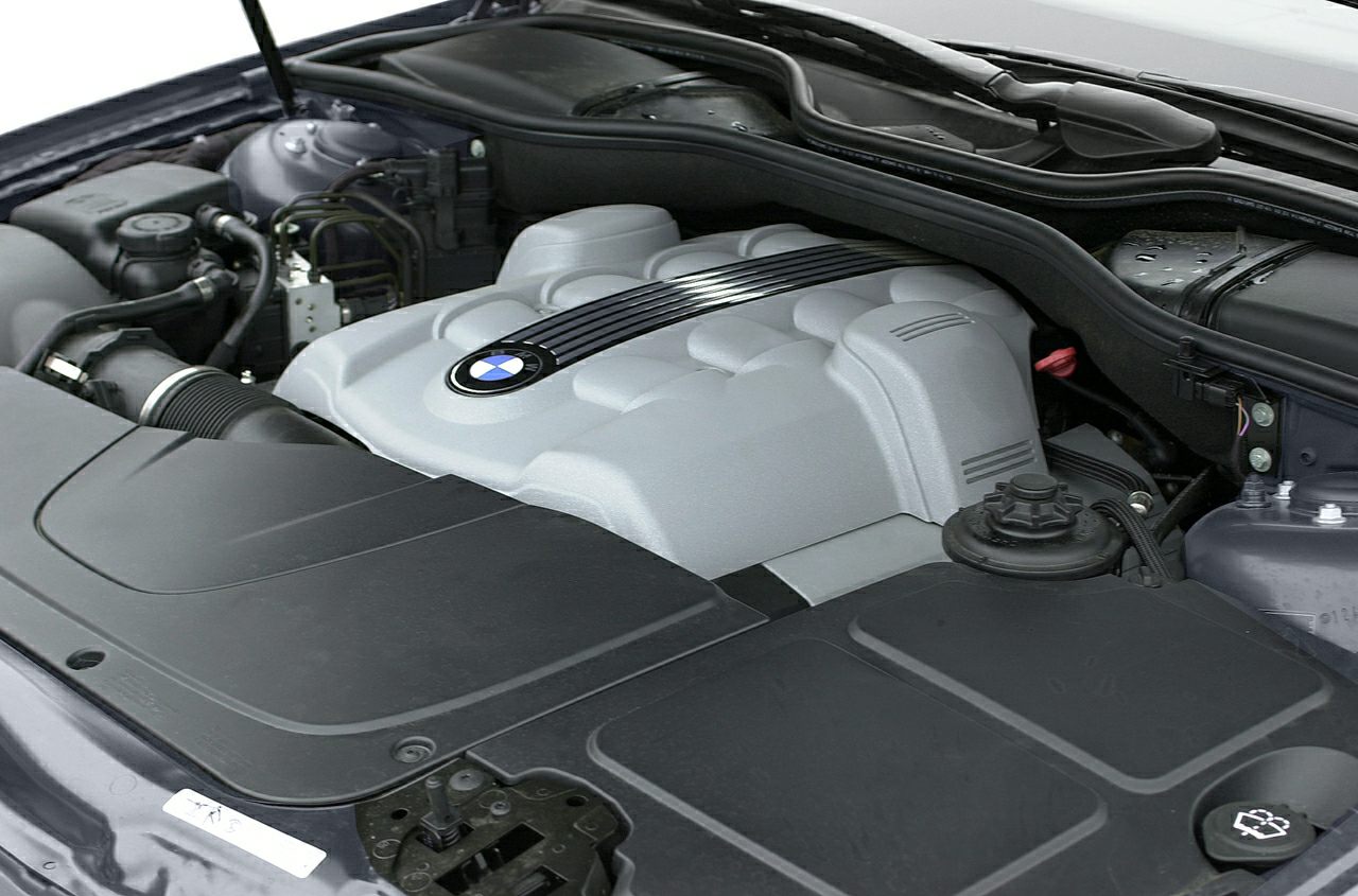 Engine bay with covered BMW V12 engine and components