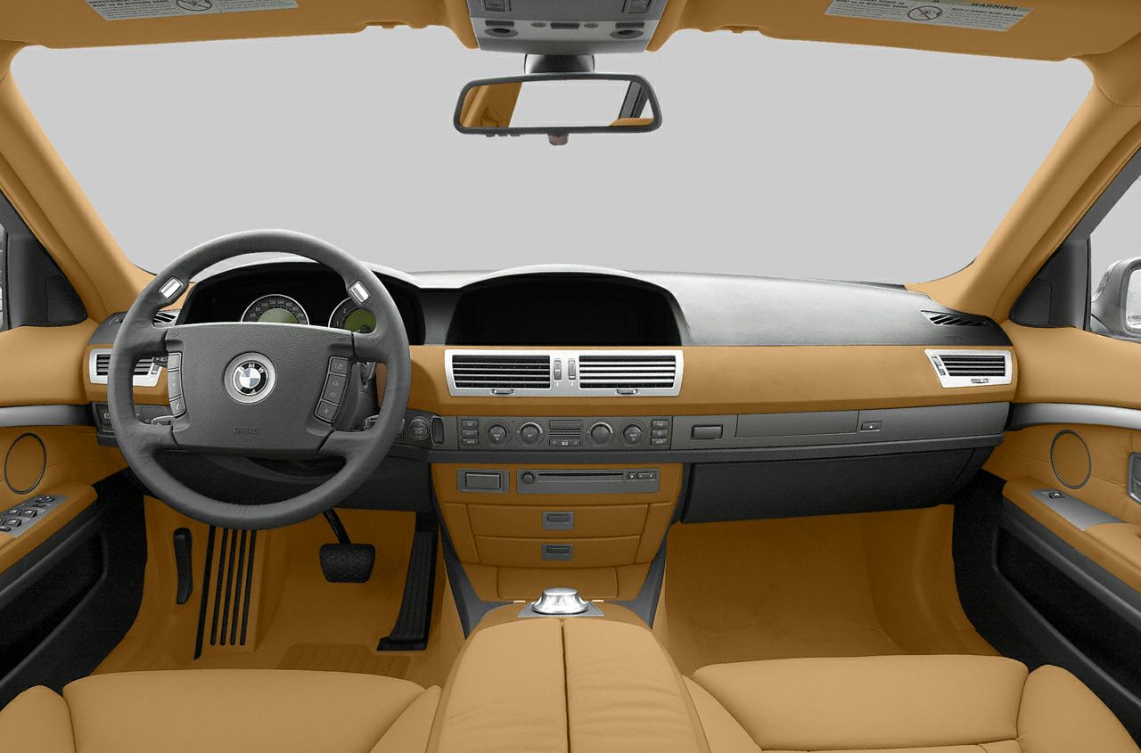 Luxury car interior with detailed dashboard and multifunction steering wheel