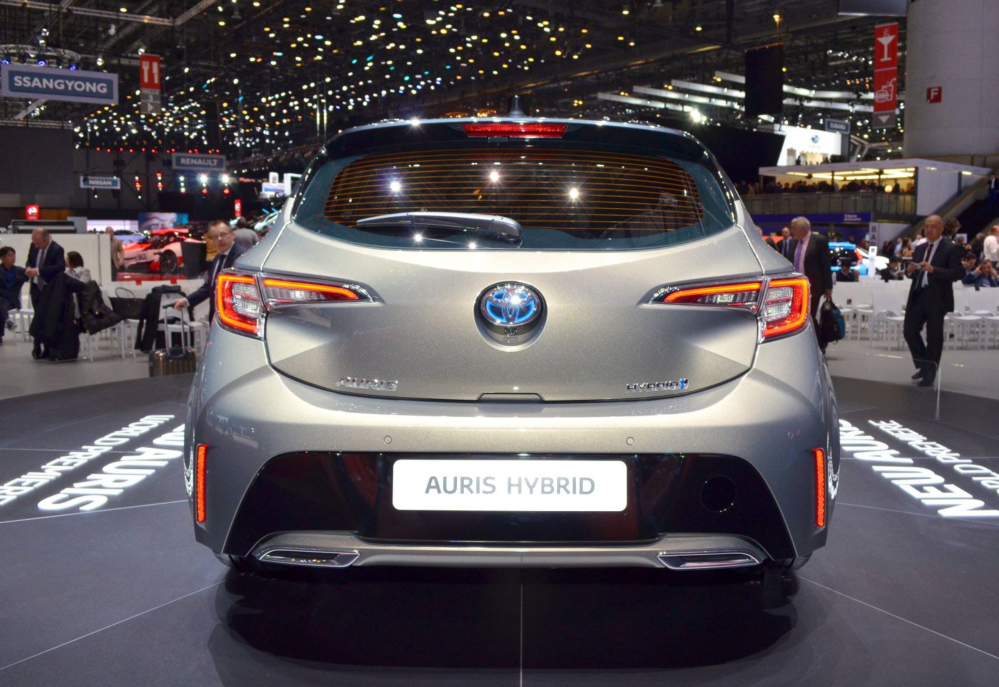 Rear view of hatchback with hybrid badge and modern tail lights
