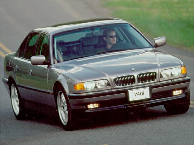 Front view of luxury sedan with dual headlights and kidney grille.