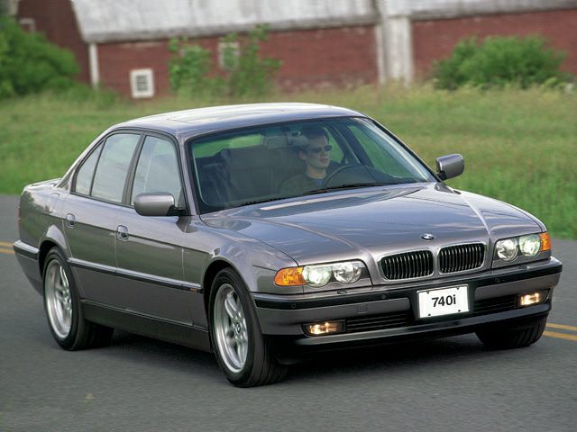 Front view luxury sedan with dual headlights and kidney grille