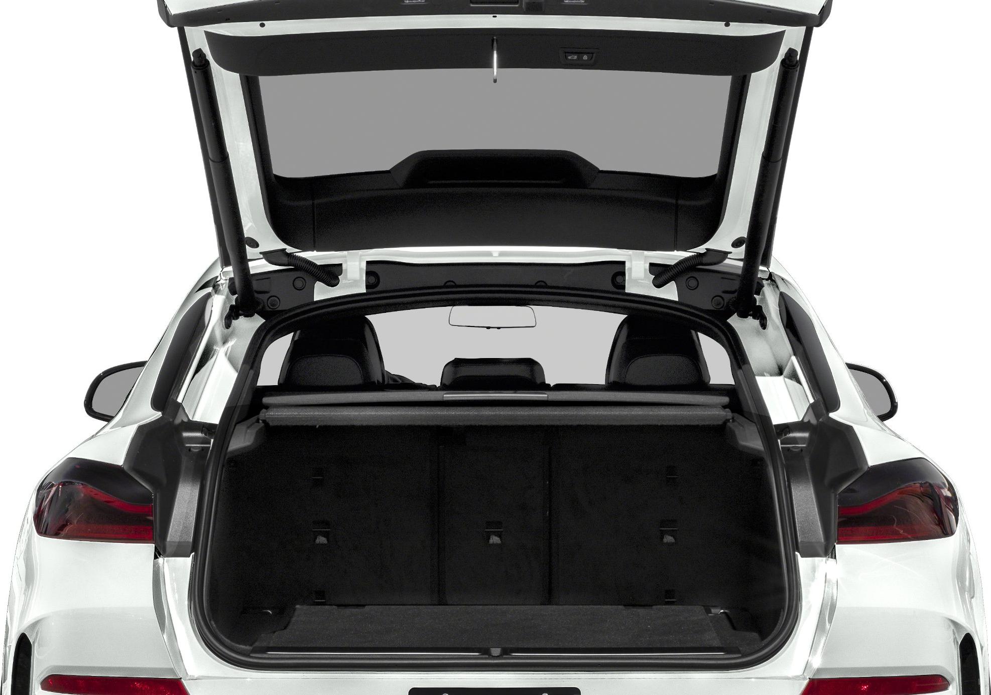 Open SUV trunk with spacious cargo interior and rear seats visible