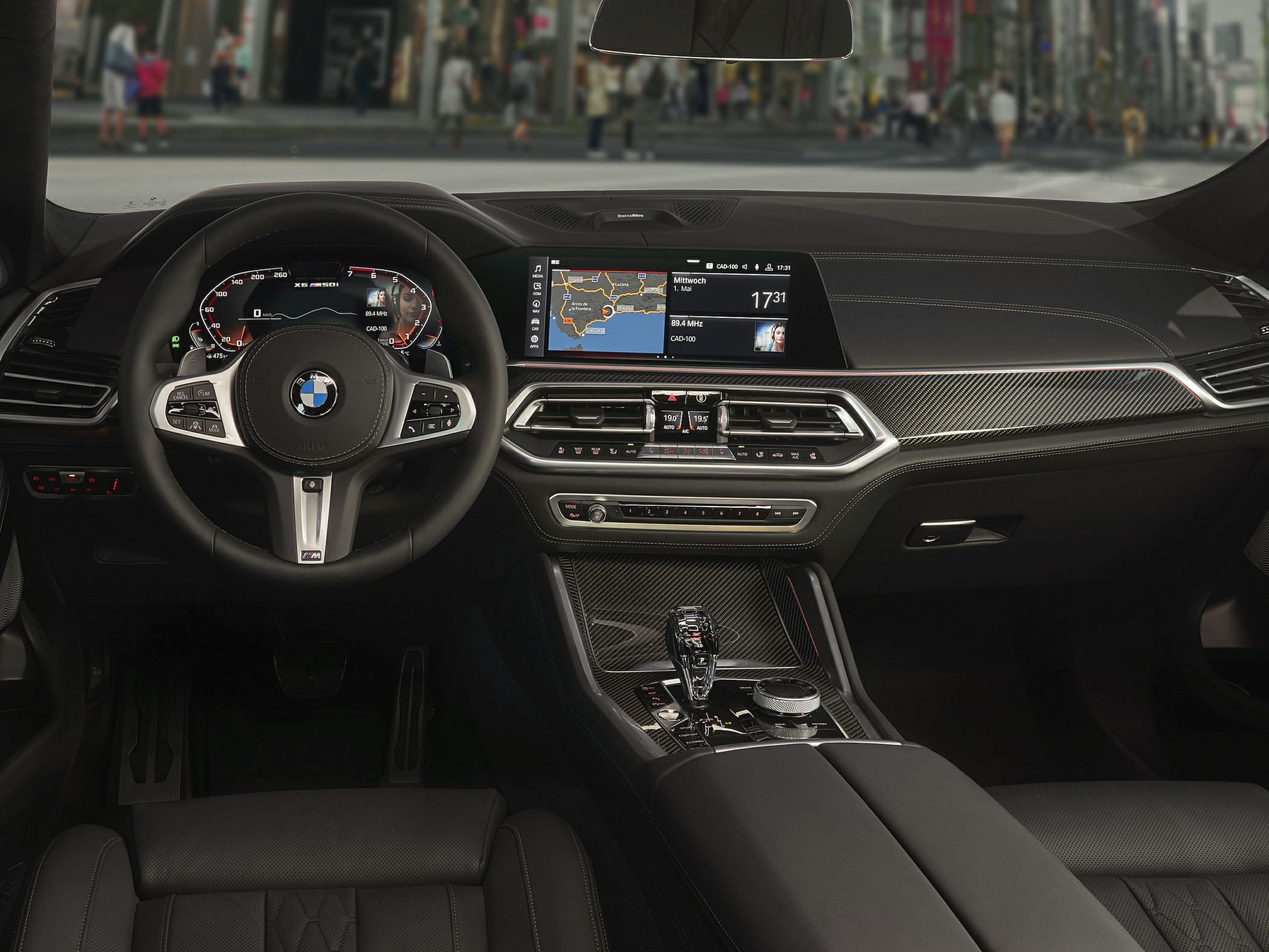 Digital instrument cluster and navigation display with carbon fiber trim
