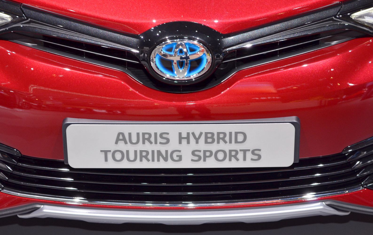 Close-up of front grille with illuminated Toyota logo