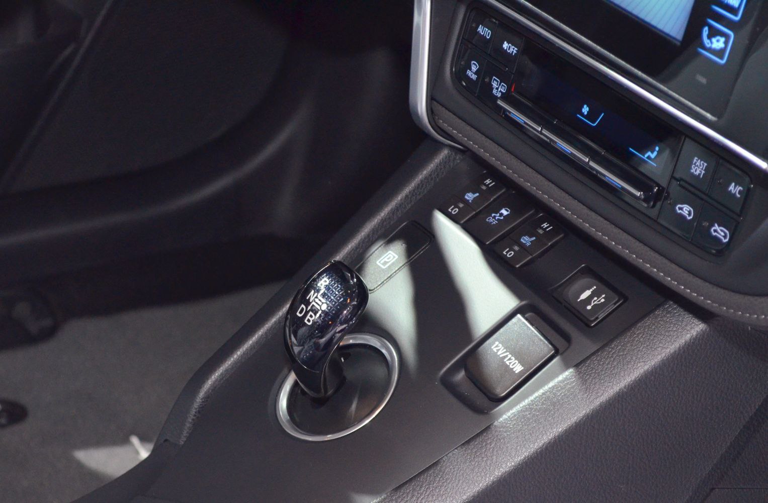 Gear shift lever and central control buttons with 12V outlet