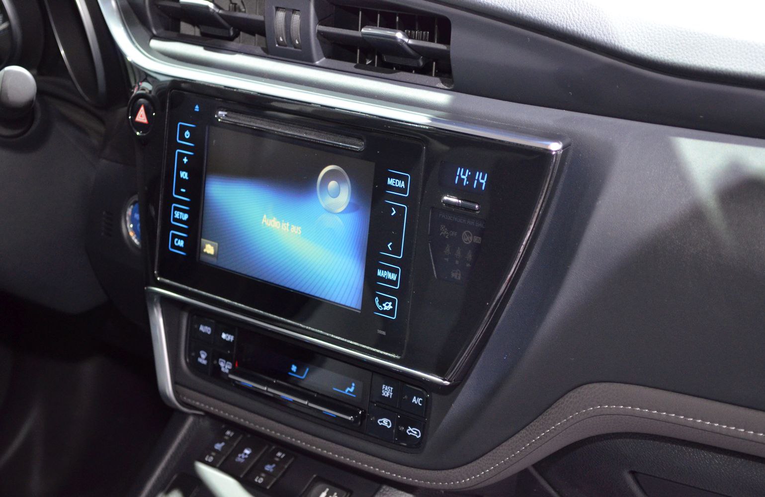 Multimedia touchscreen and climate control panel with digital clock