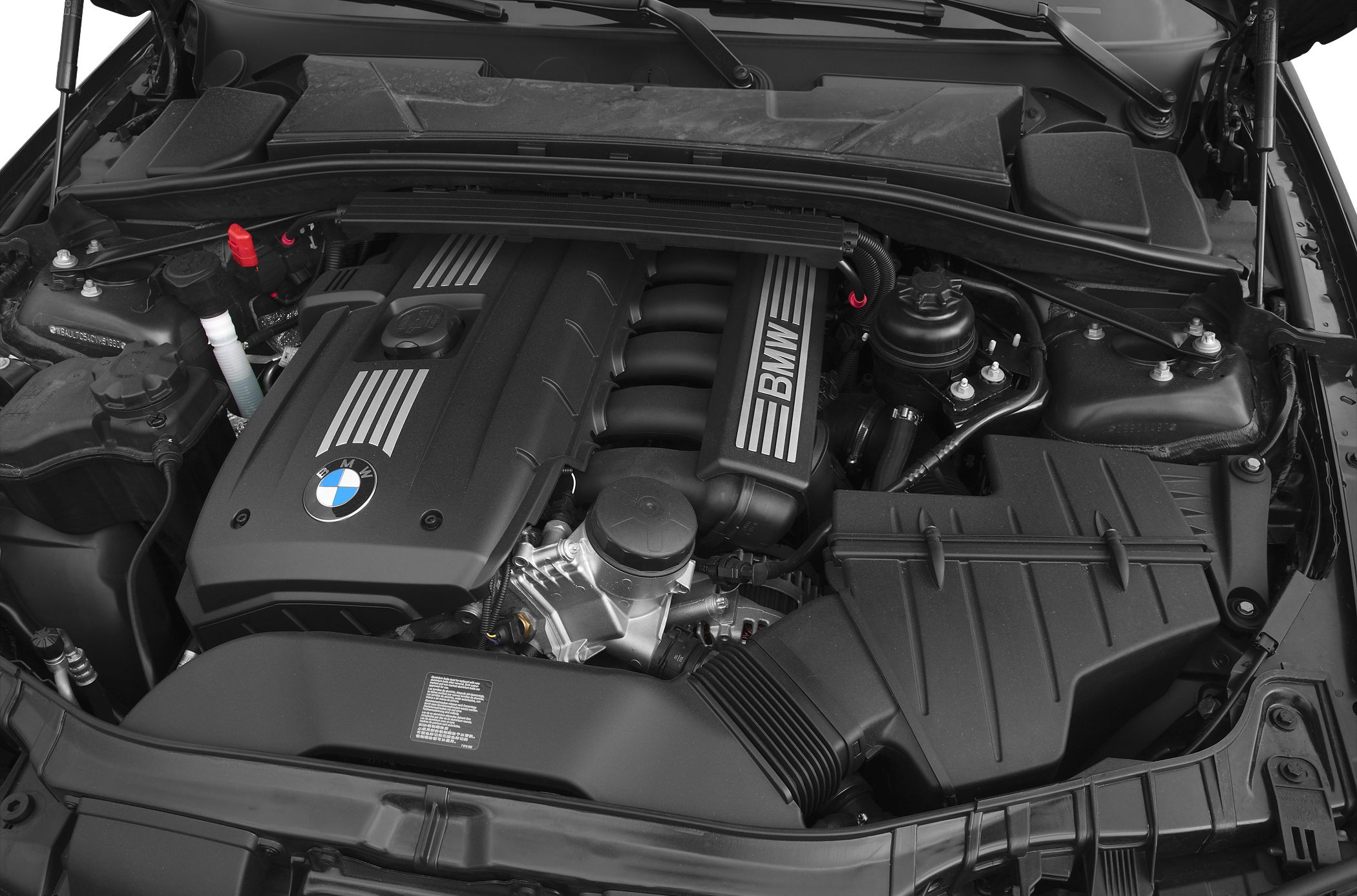 Engine bay with BMW-branded engine cover and intake manifold