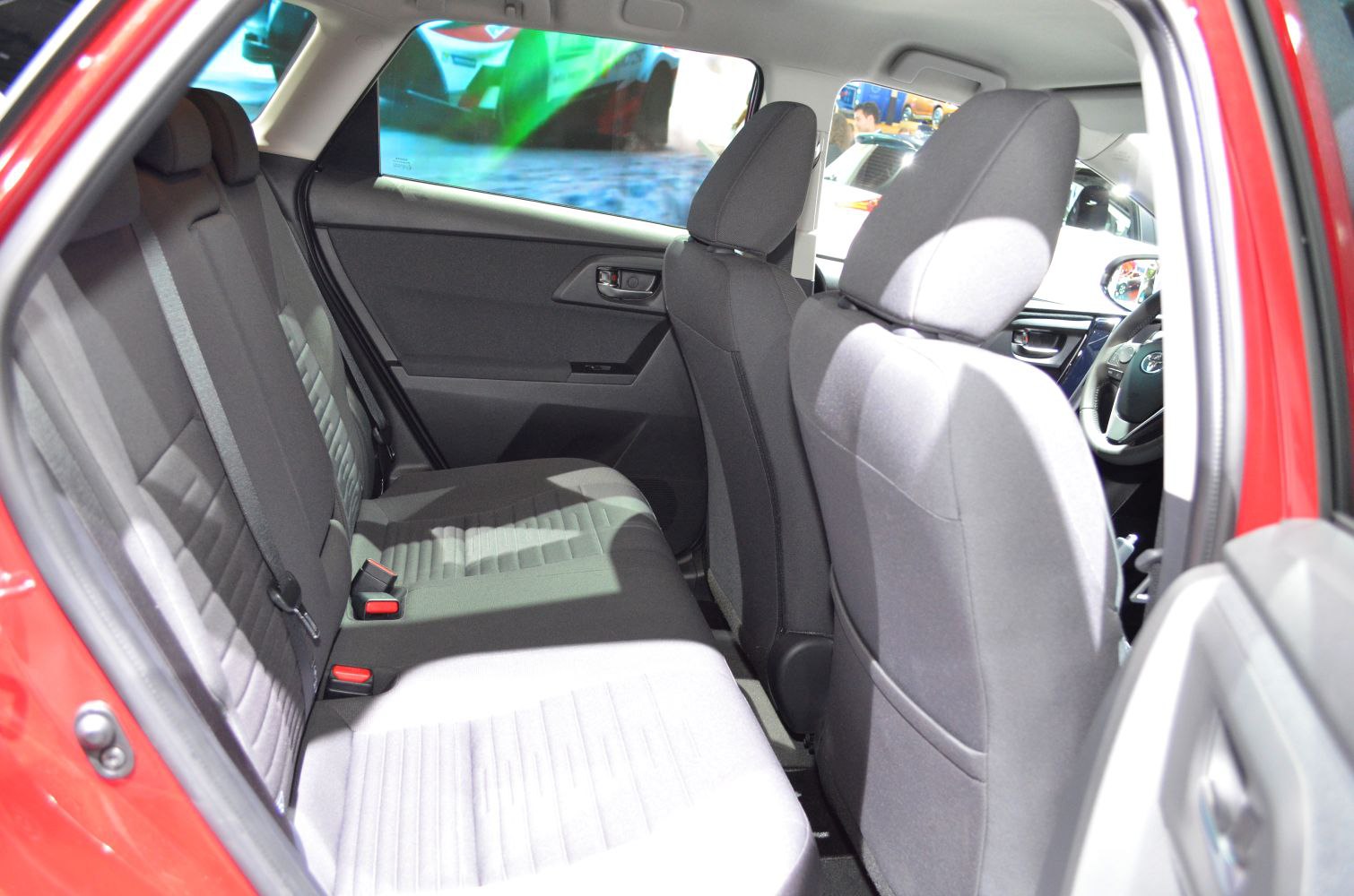 Rear seating and interior upholstery with headrests and door panel.