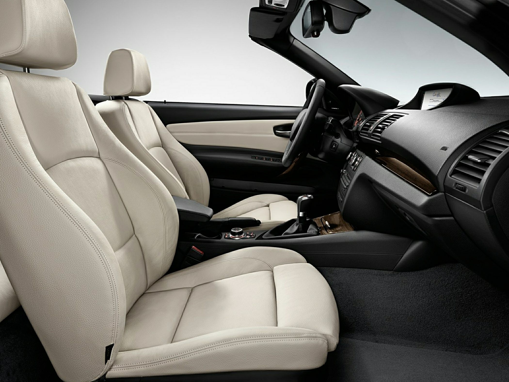 Beige leather seats and wood trim dashboard interior