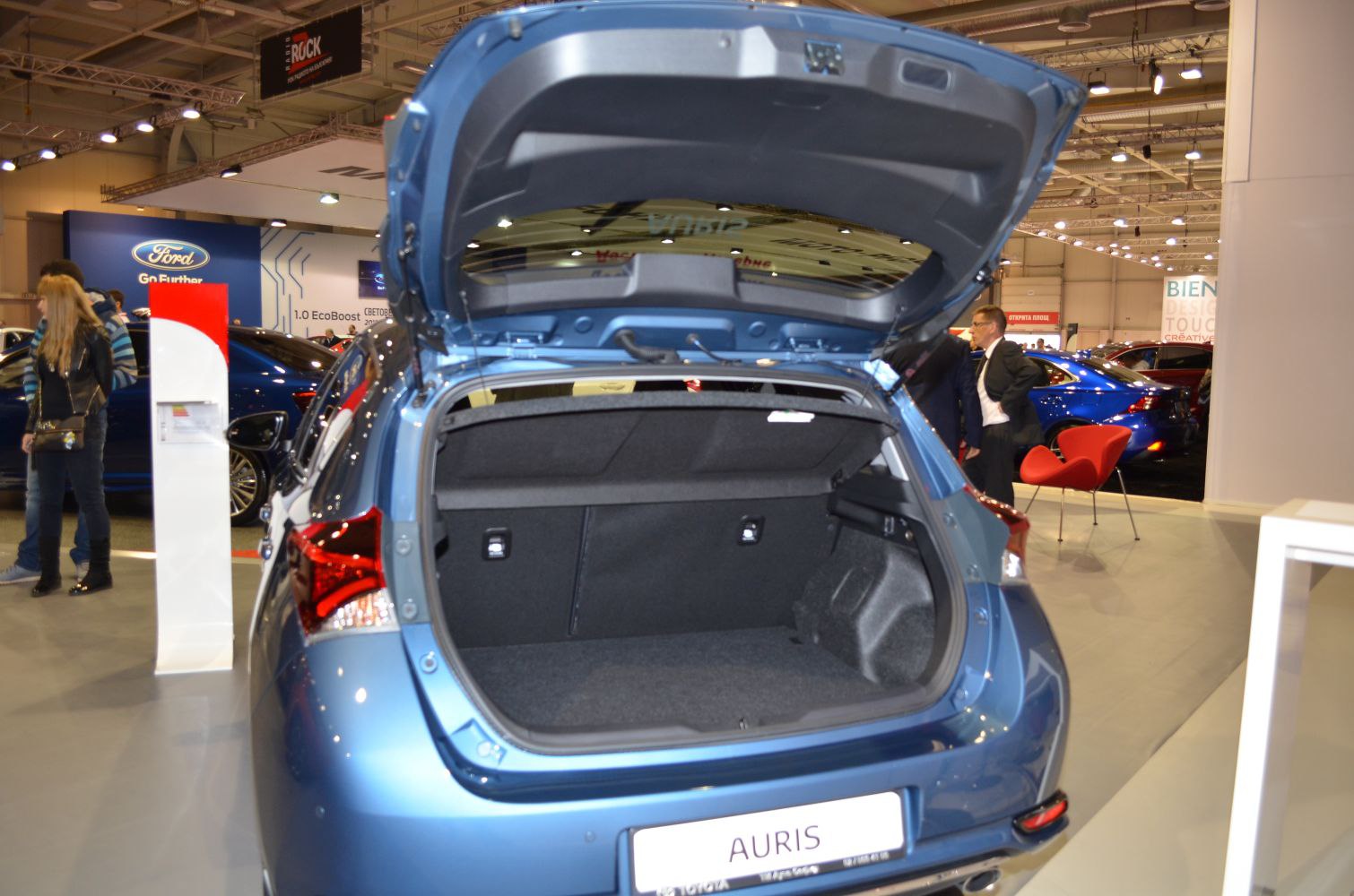 Open trunk view of a hatchback car showing spacious cargo area and rear tail lights.