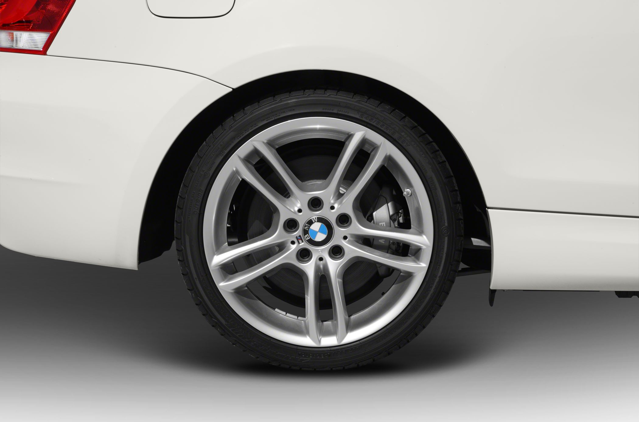 Silver alloy wheel with BMW logo and visible brake caliper
