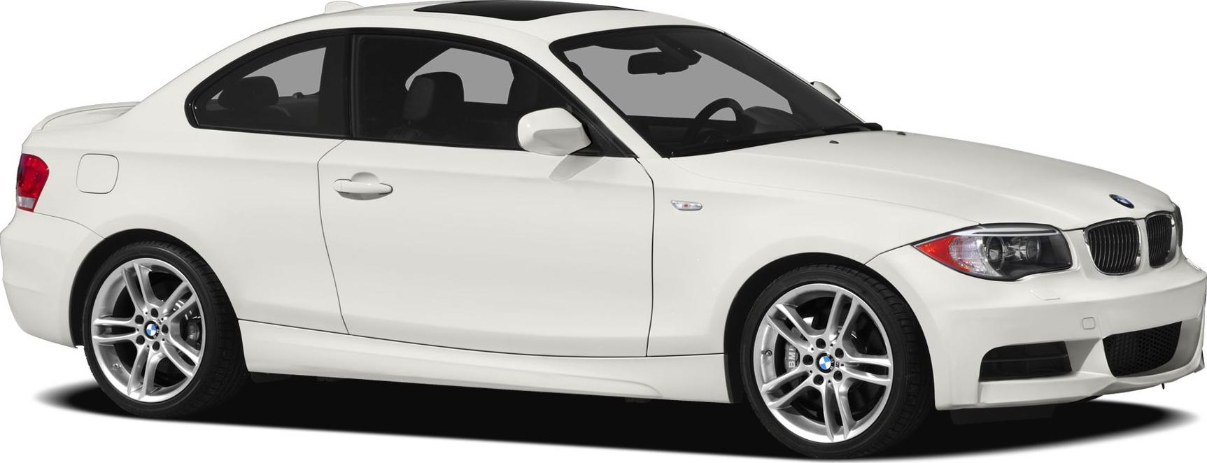 White sporty coupe with alloy wheels, side profile view