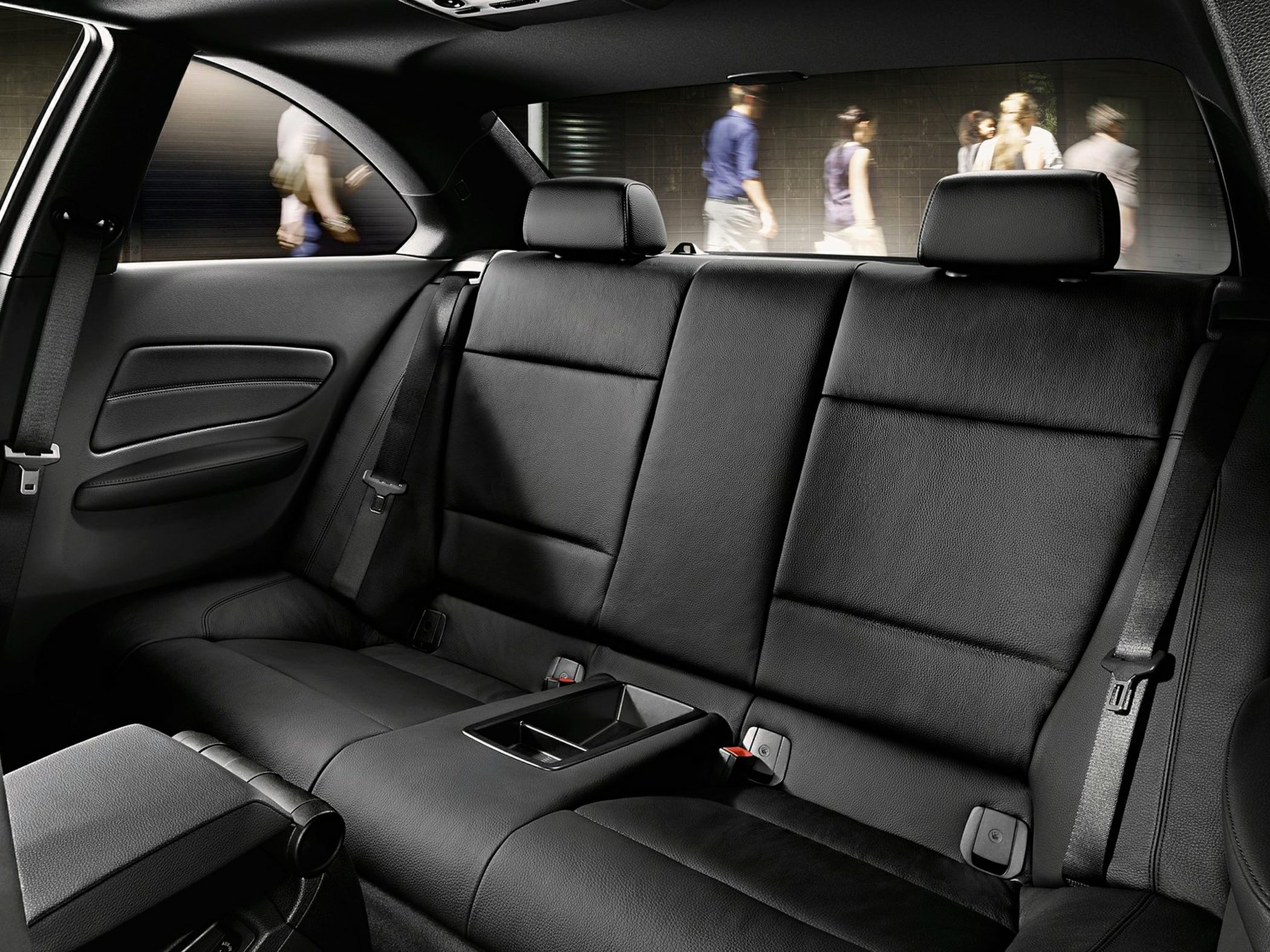 Black leather rear seats with headrests and armrest