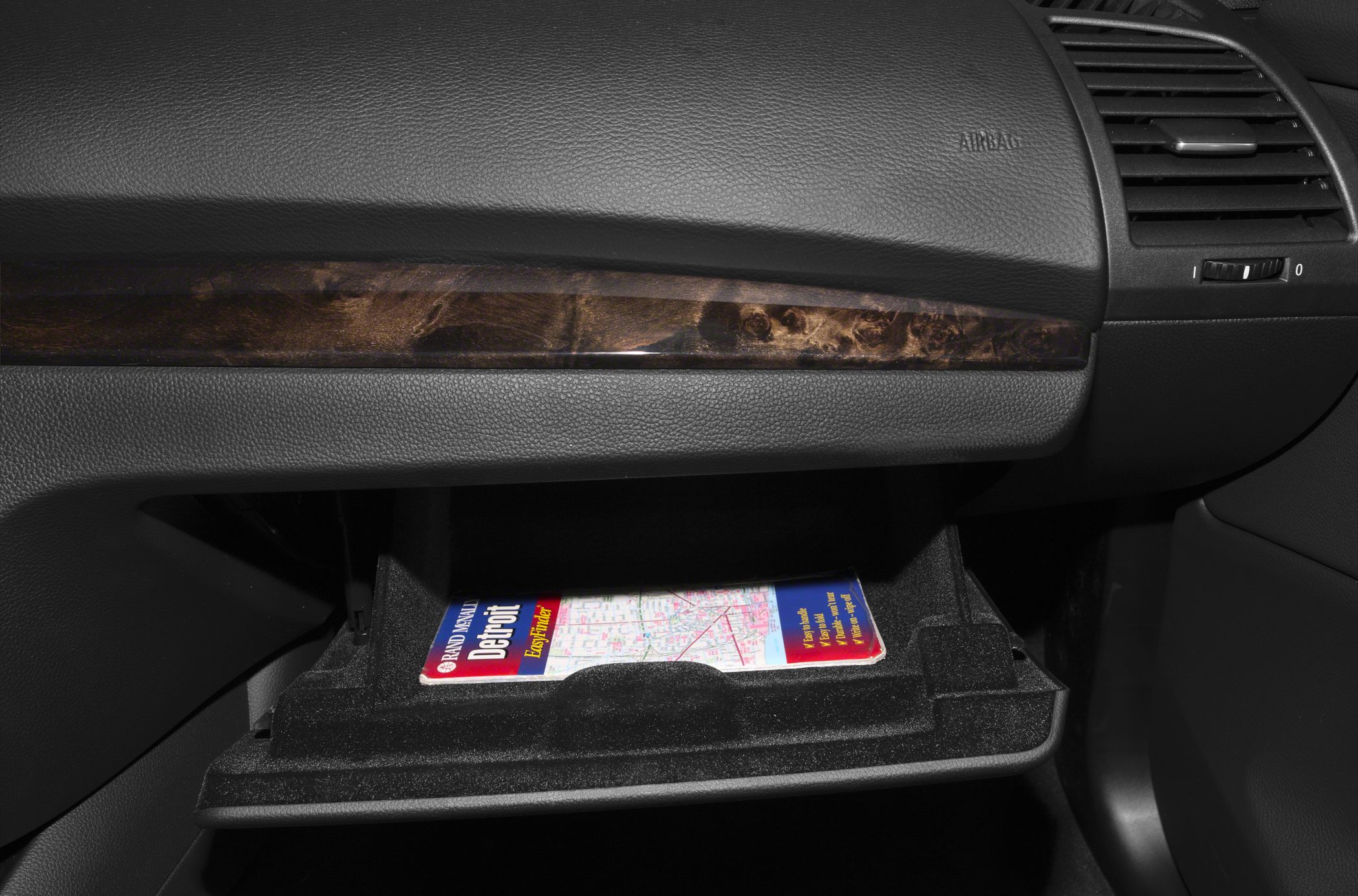 Glove box with wood trim and storage compartment