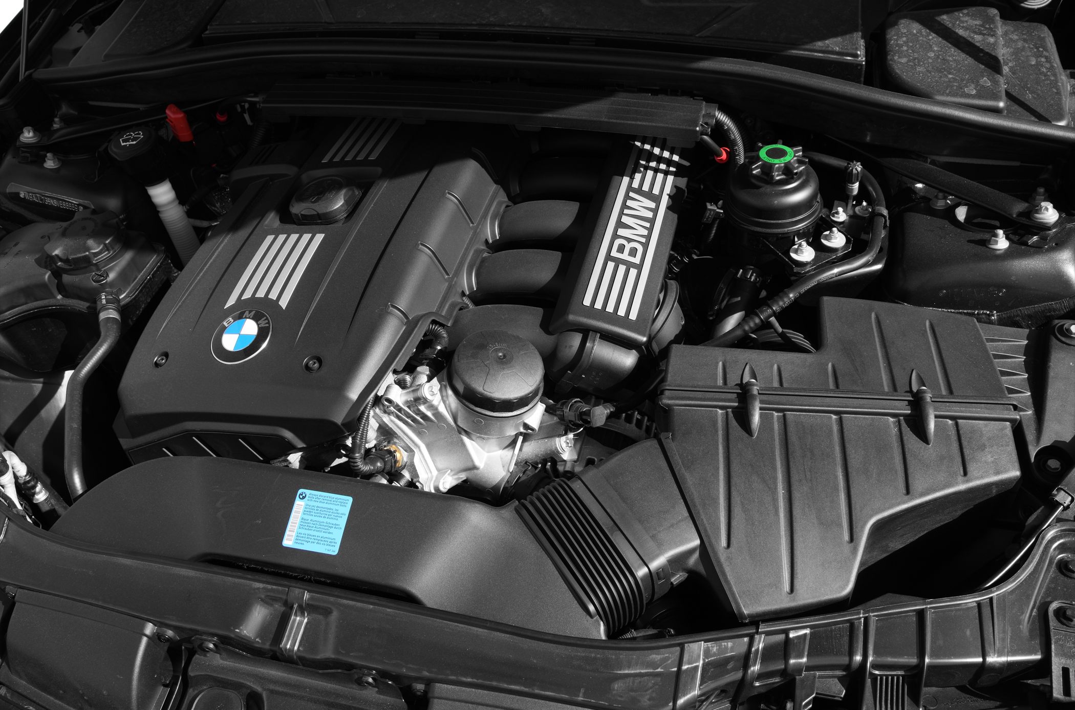 Engine bay with BMW-branded engine cover and intake manifold