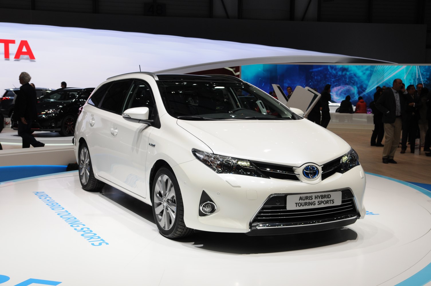 Front-left view with sleek headlights and aerodynamic design