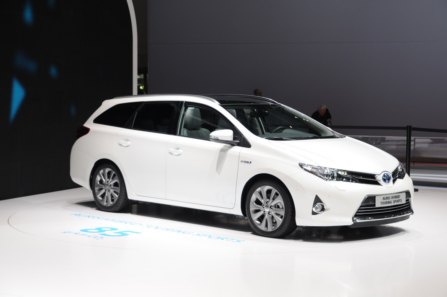 Front-side view of hybrid wagon with sleek headlights and aerodynamic design